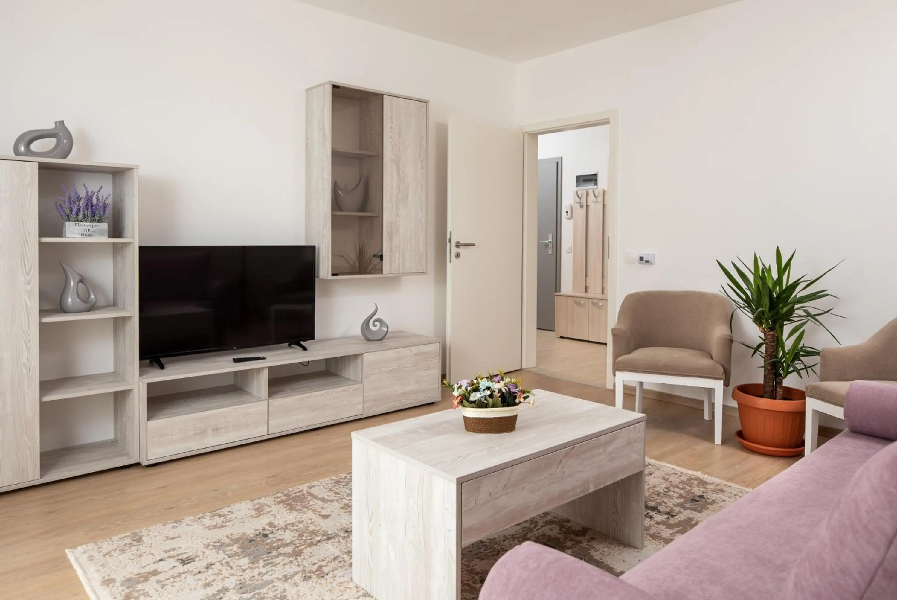 Communal lounge/ TV room in Brasov Holiday Apartments