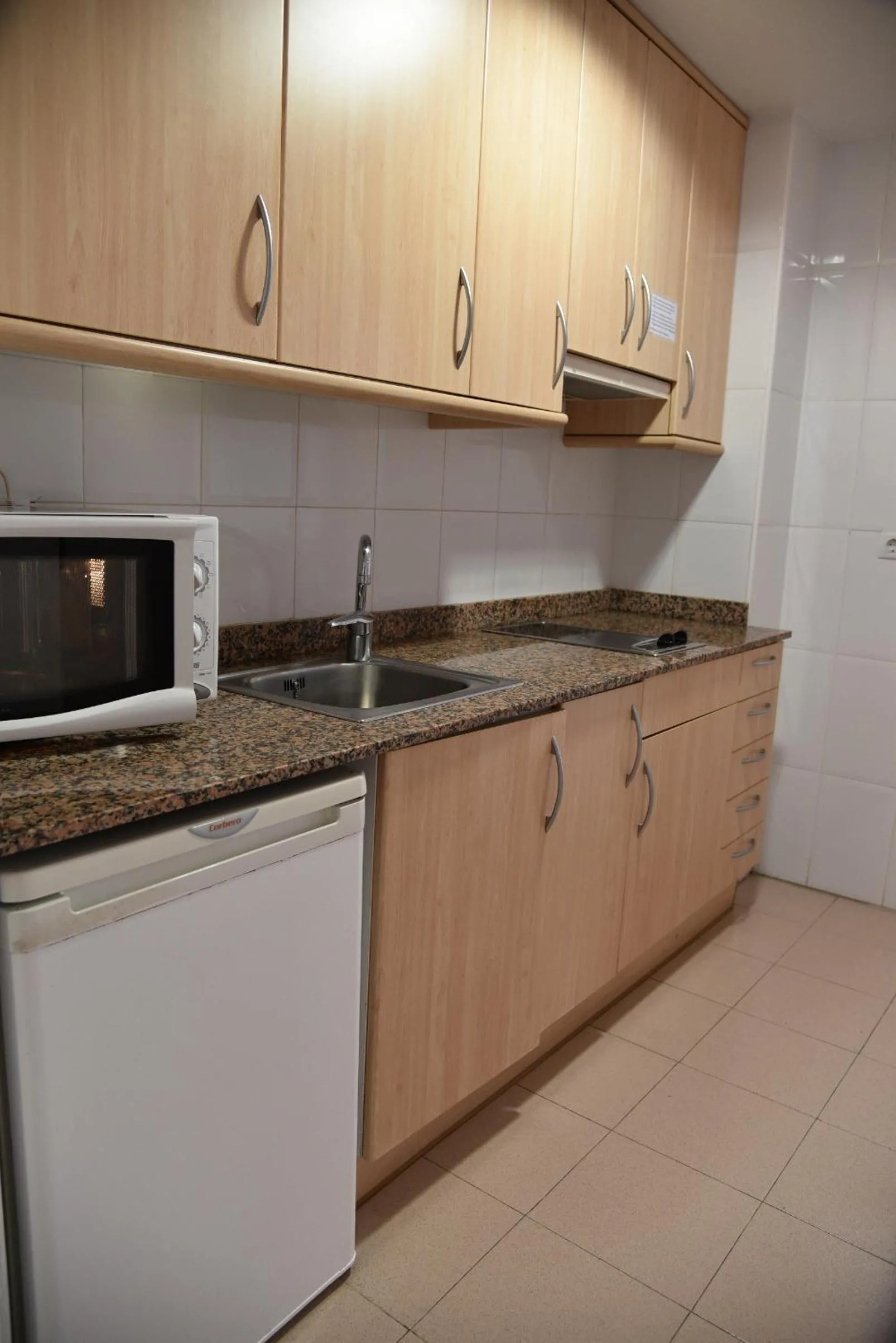 Kitchen or kitchenette in Apartamentos AR Dosjoimi