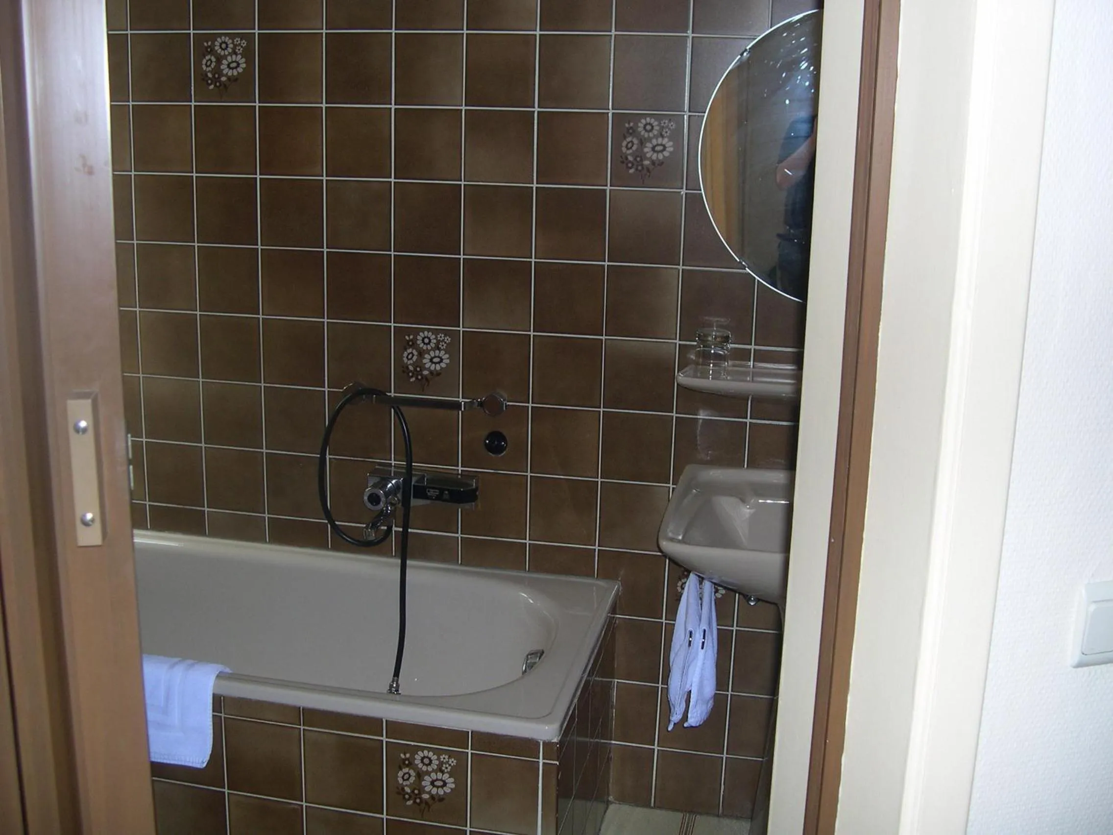 Bathroom in Hotel Beau Rivage and Restaurant Koulic