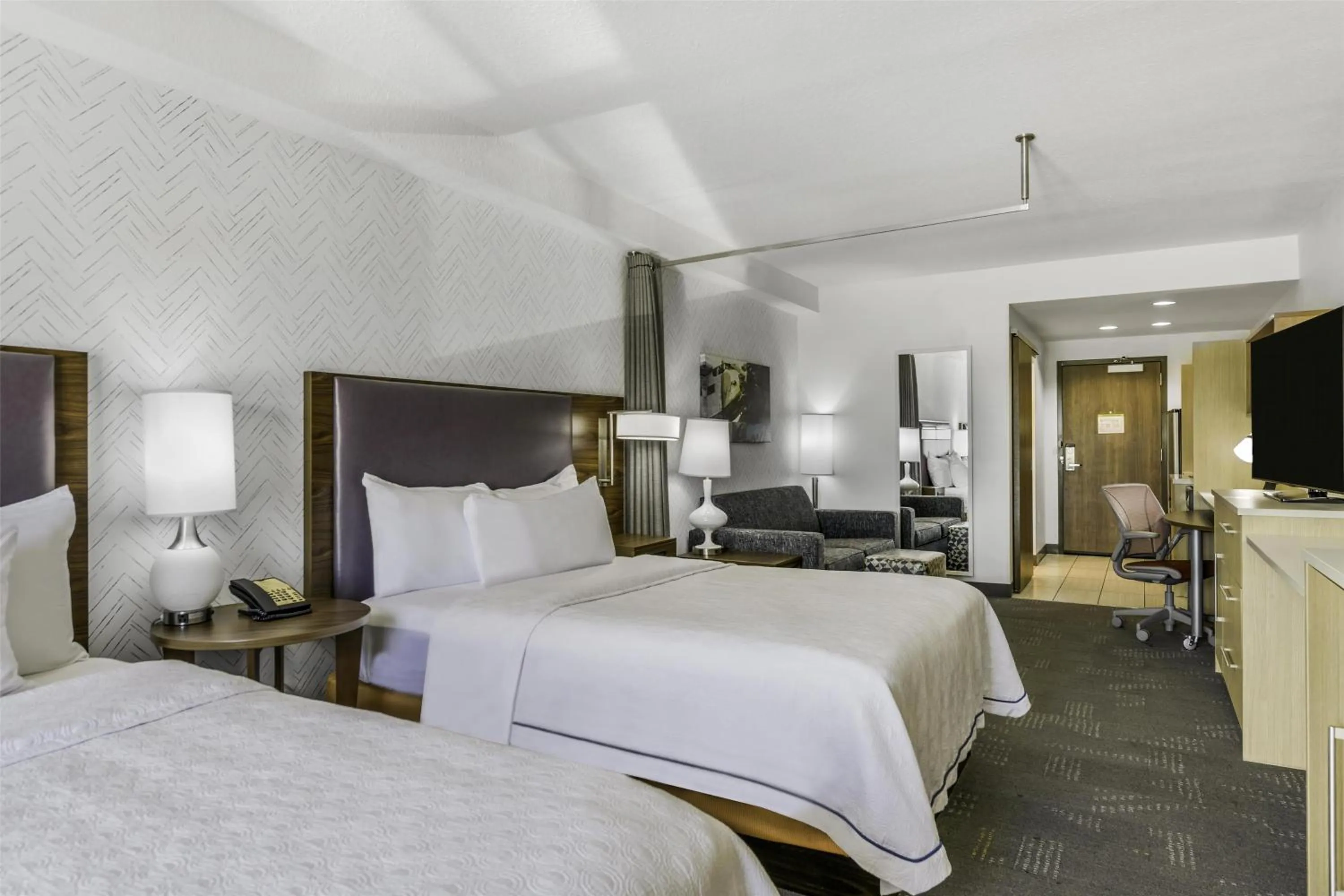 Living room, Bed in Home2 Suites By Hilton St. Simons Island