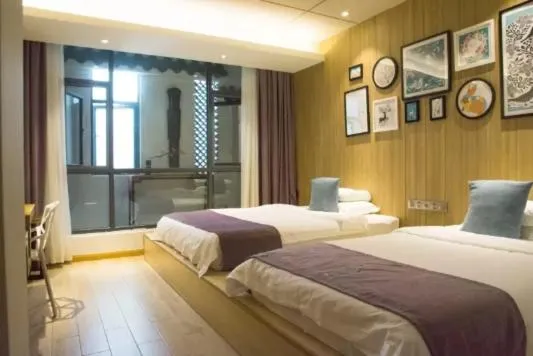 Photo of the whole room, Bed in Ancient Street No.5 Youth Chic Hotel