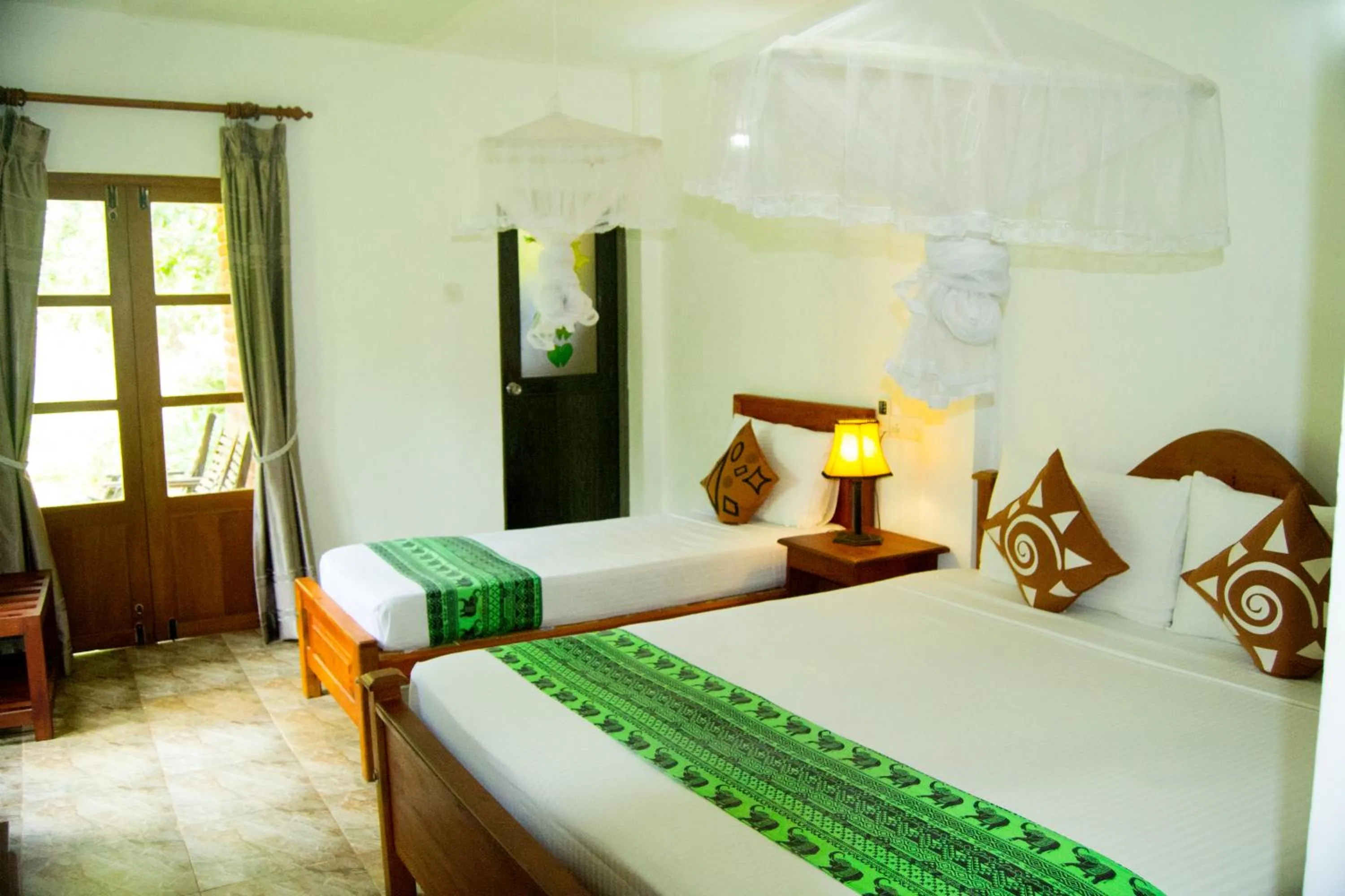 Bed in Sigiri Heritage Villa