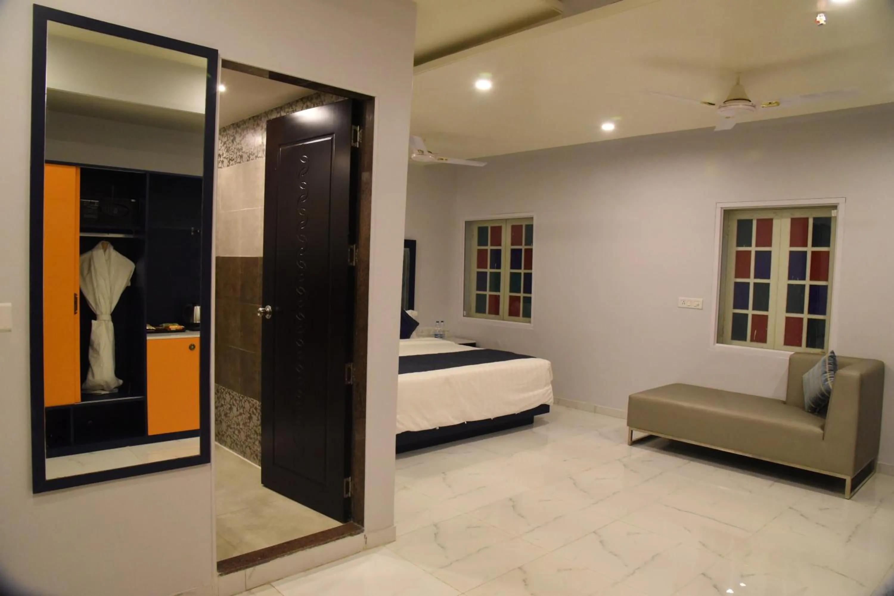 Living room, Bed in Regenta Inn Vadodara, 500m from Railway Station