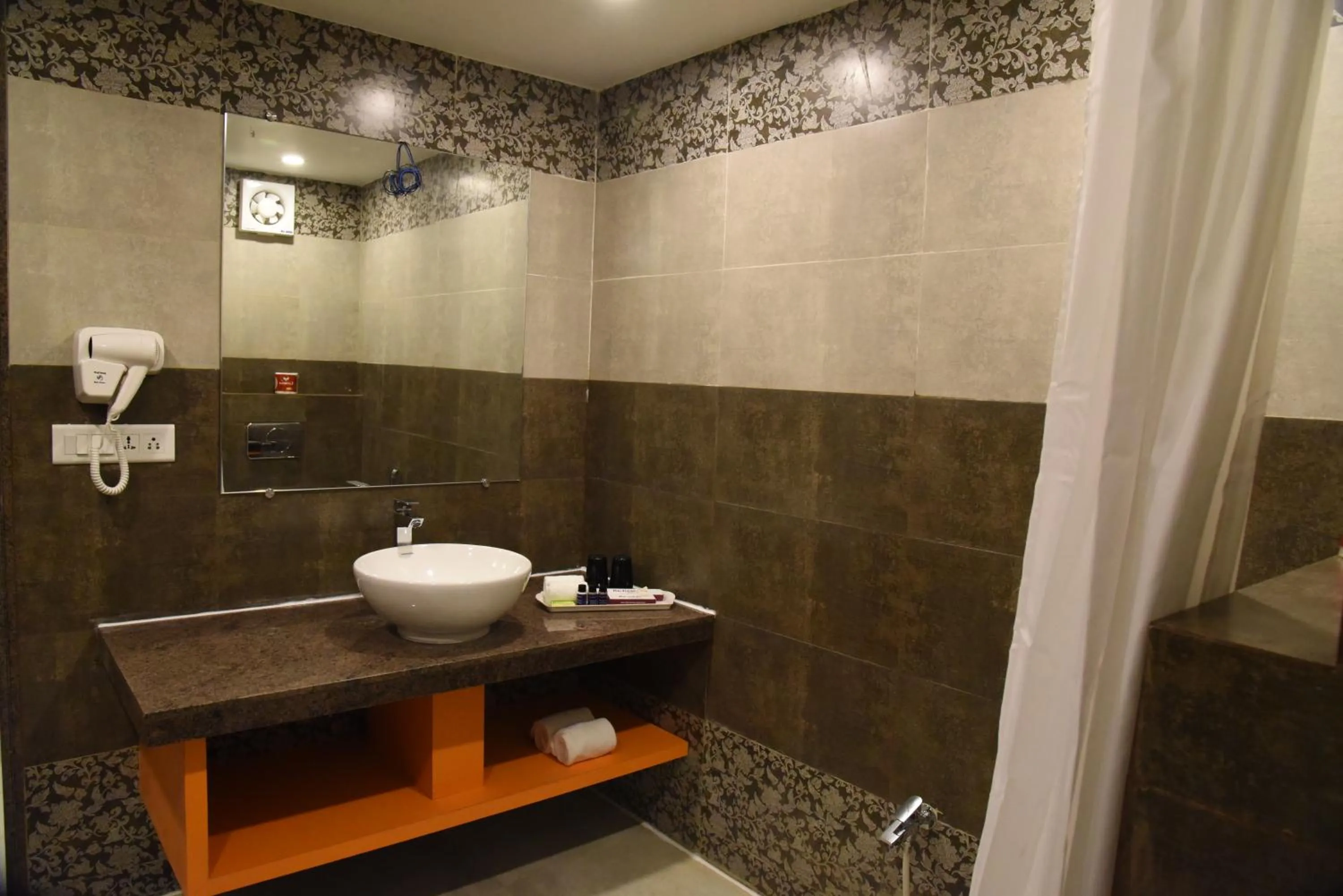 Bathroom in Regenta Inn Vadodara, 500m from Railway Station