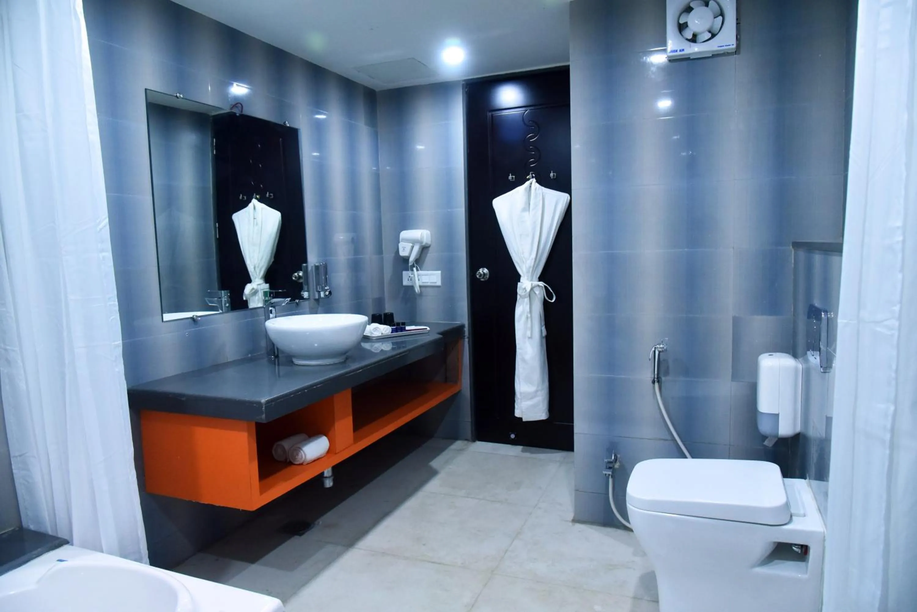 Bathroom in Regenta Inn Vadodara, 500m from Railway Station