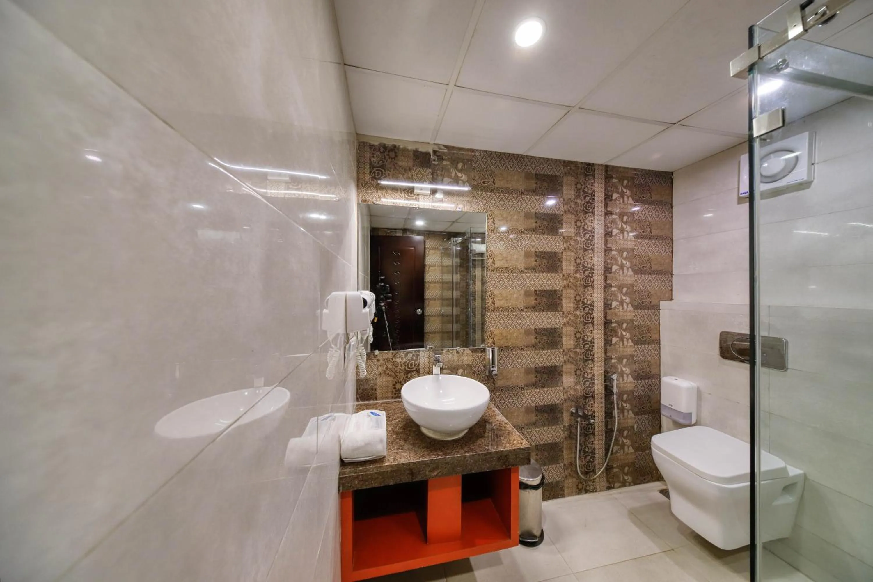Bathroom in Regenta Inn Vadodara, 500m from Railway Station