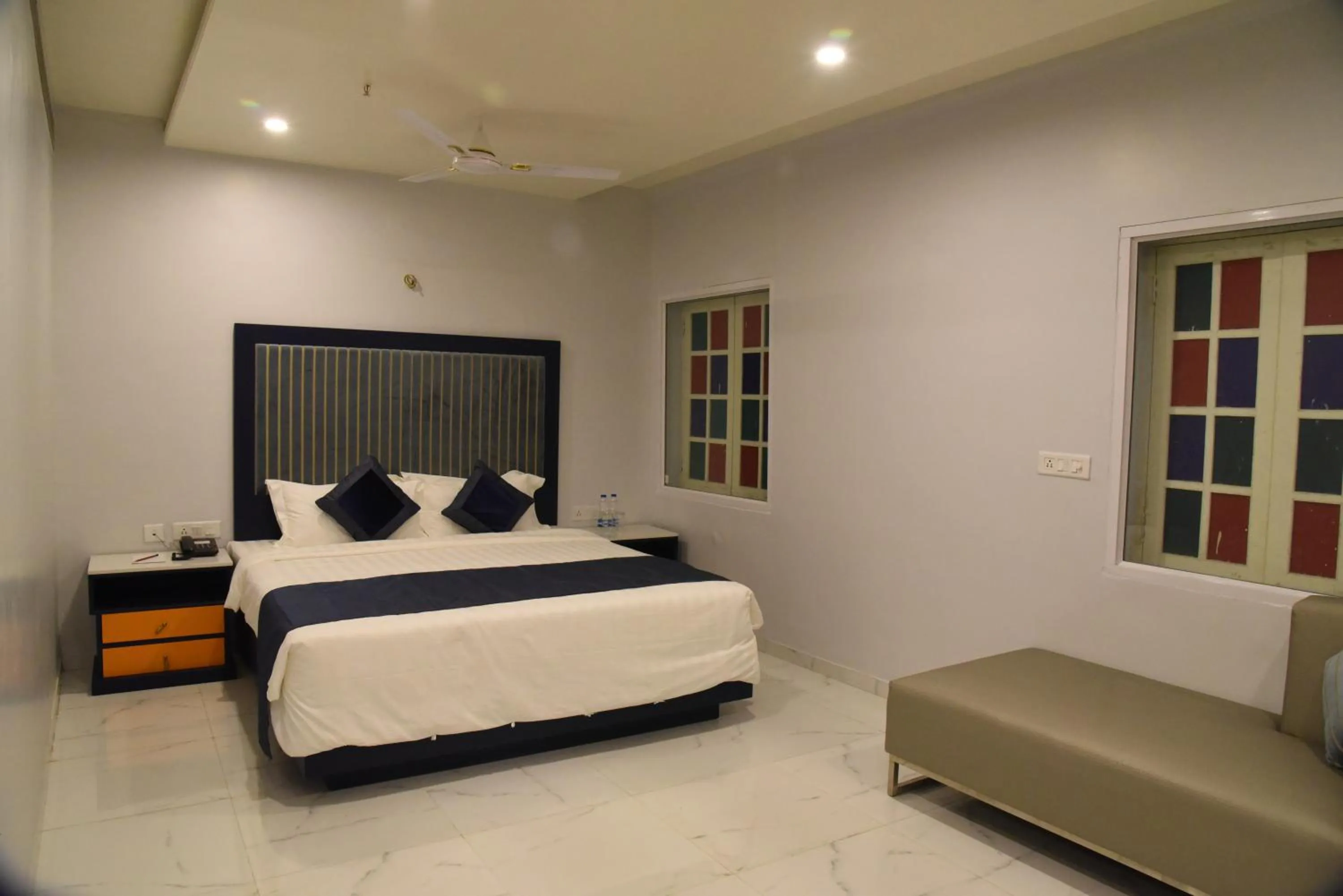 Living room, Bed in Regenta Inn Vadodara, 500m from Railway Station