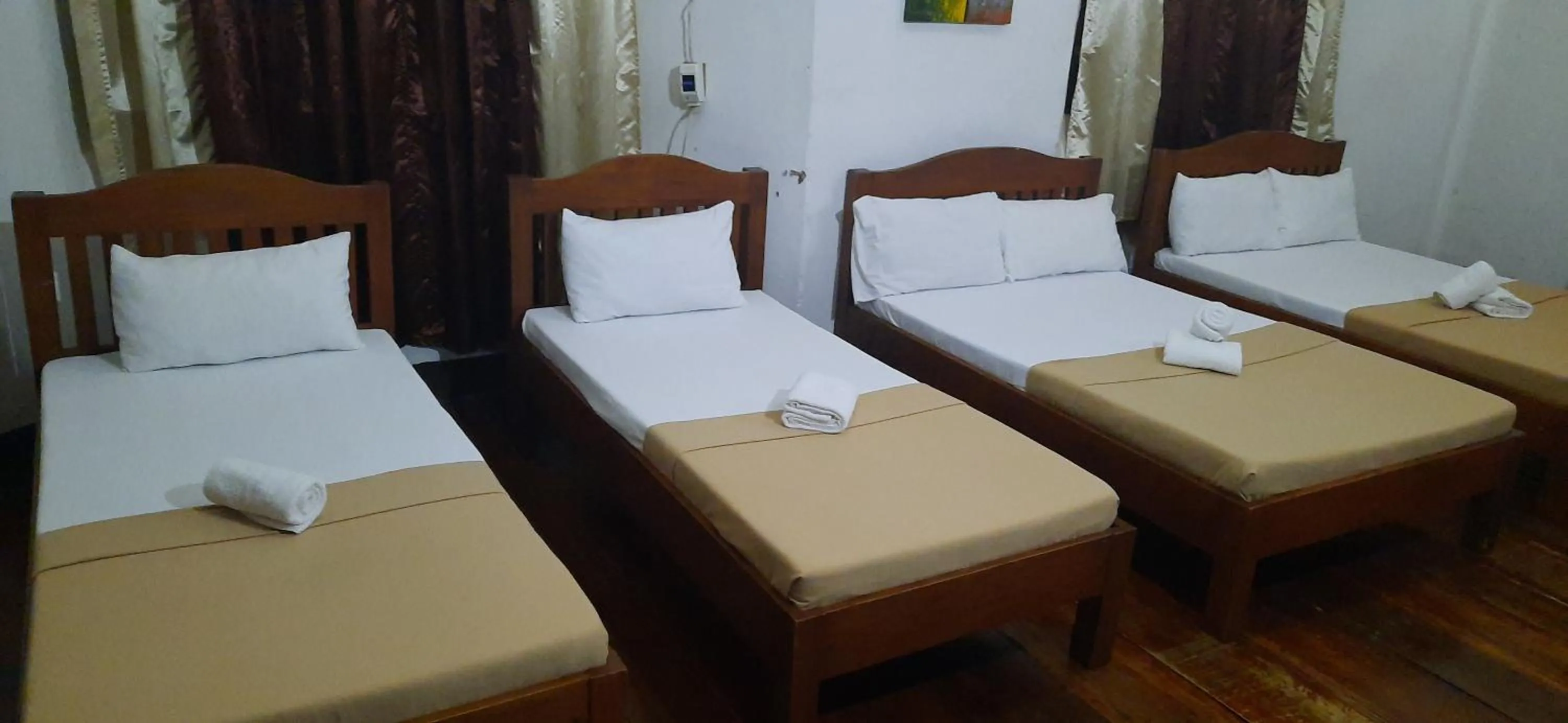 Bed in Escolta's Homey Lodge