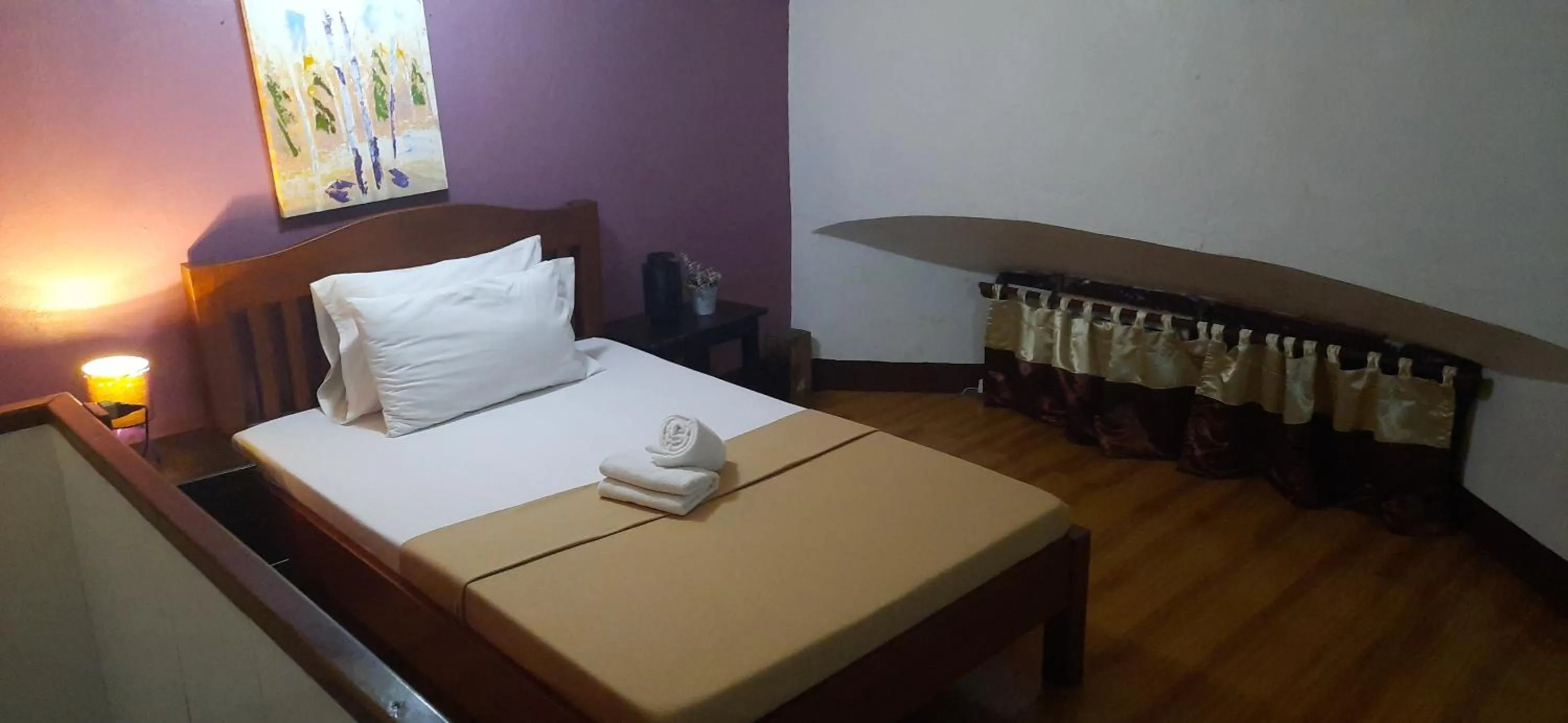 Bed in Escolta's Homey Lodge