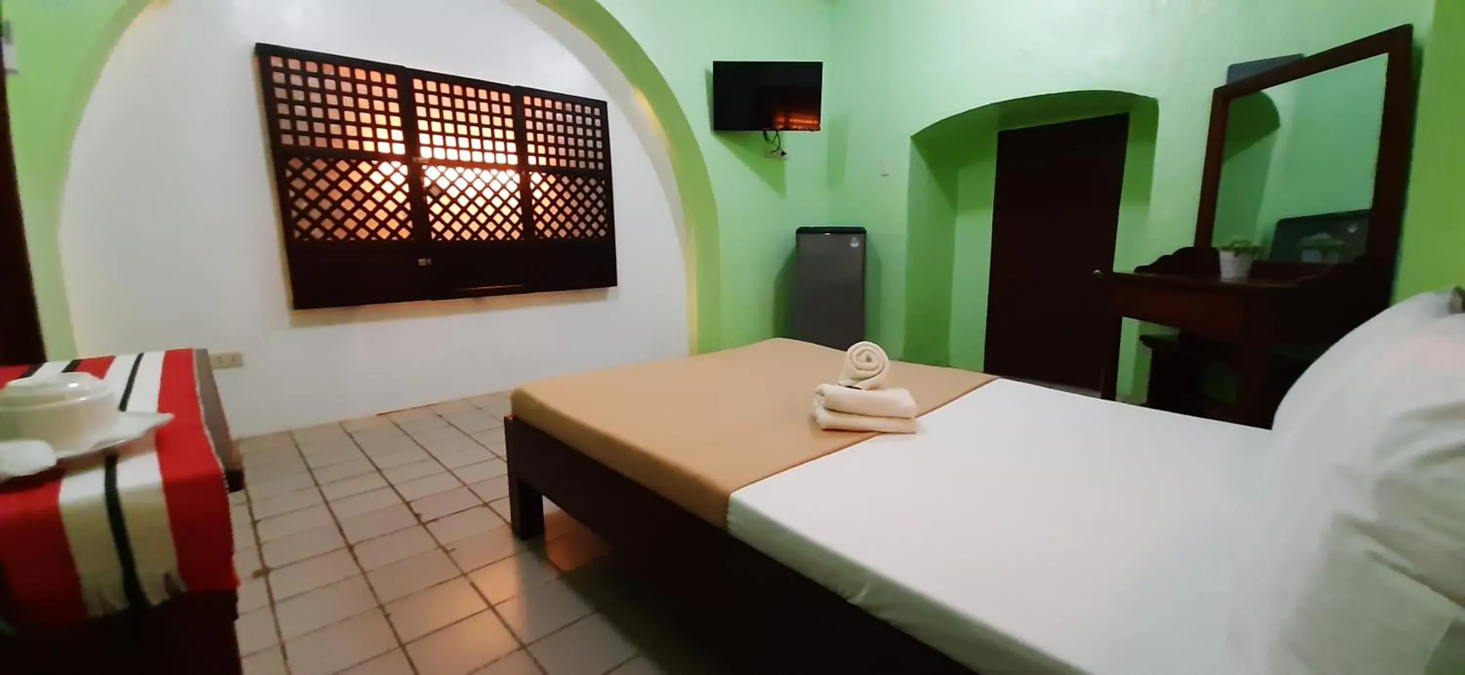 Bed in Escolta's Homey Lodge Bed in Escolta's Homey Lodge