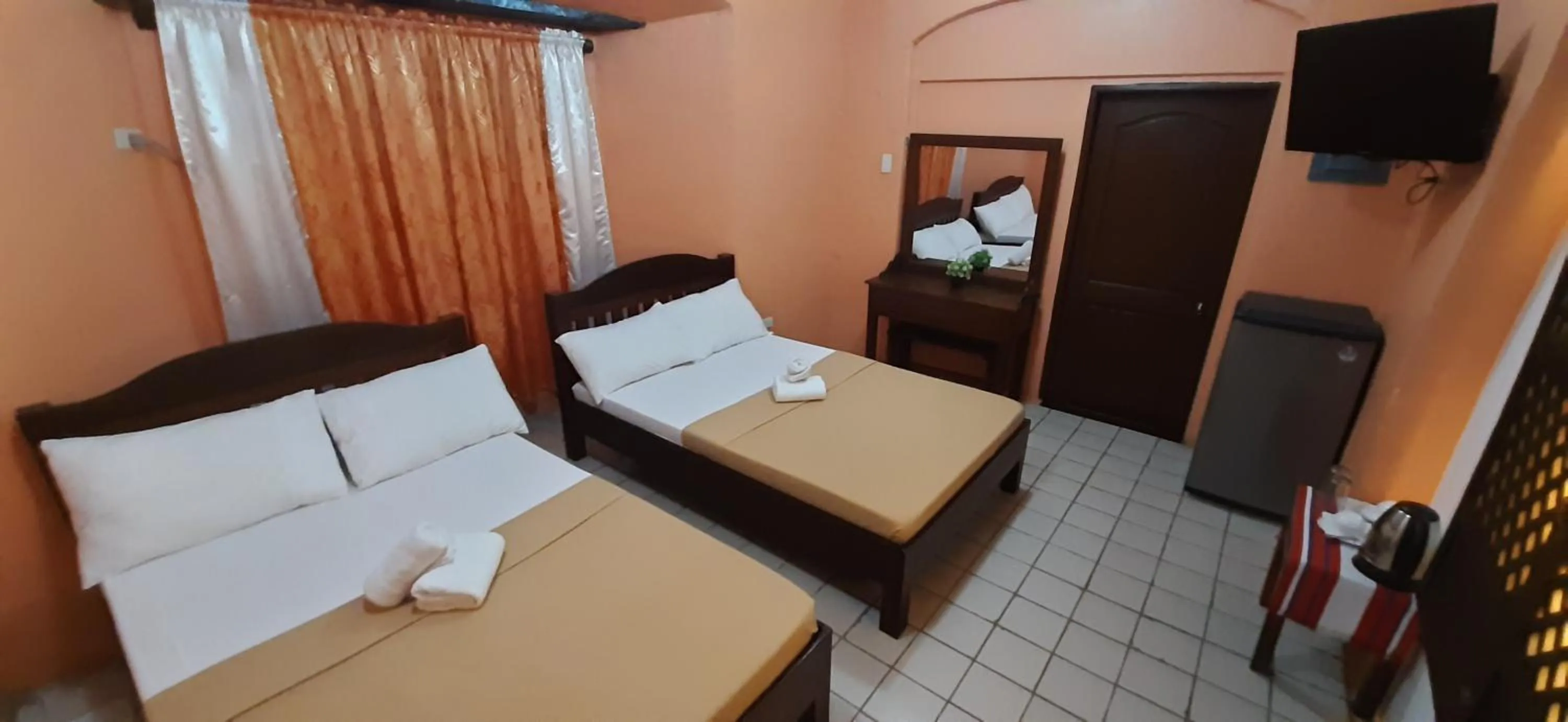 Bed in Escolta's Homey Lodge