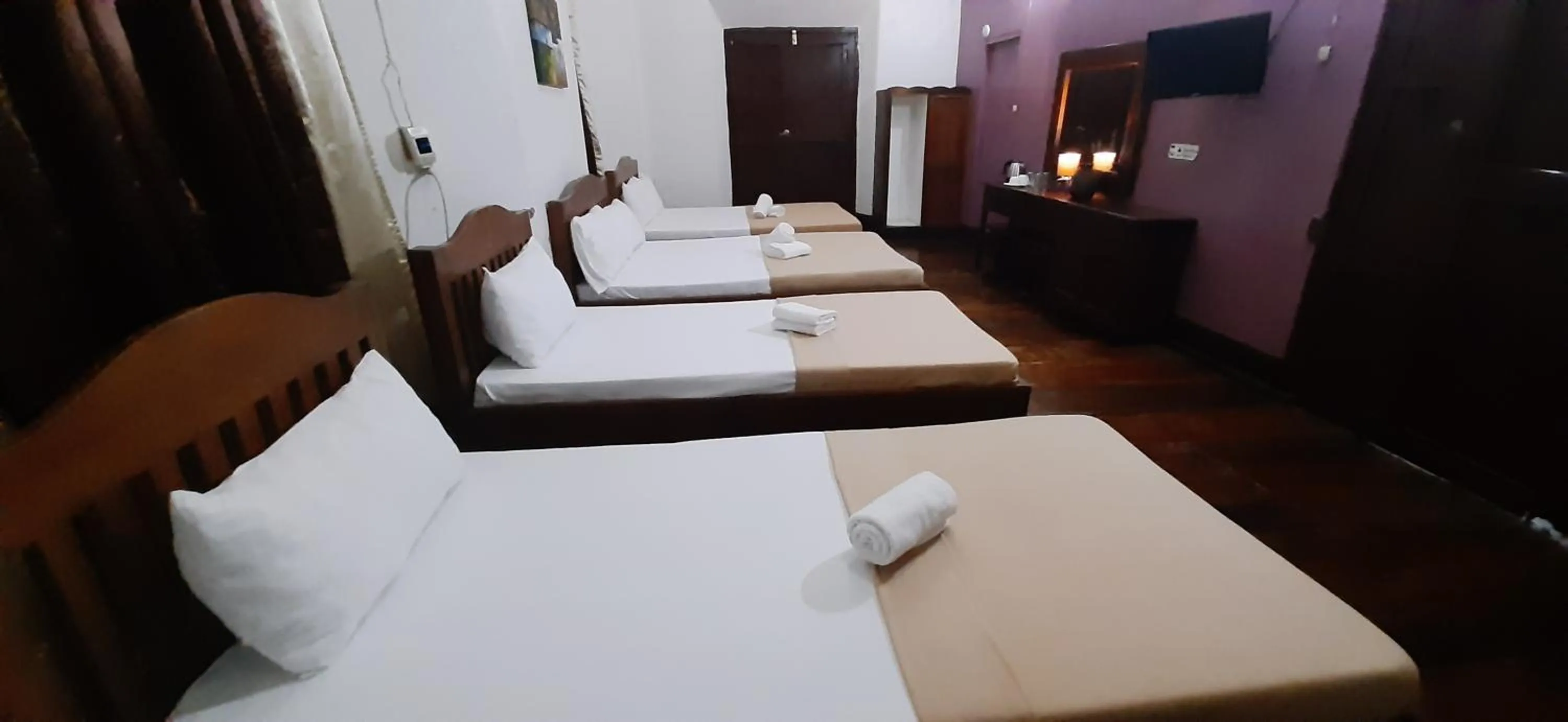 Bed in Escolta's Homey Lodge