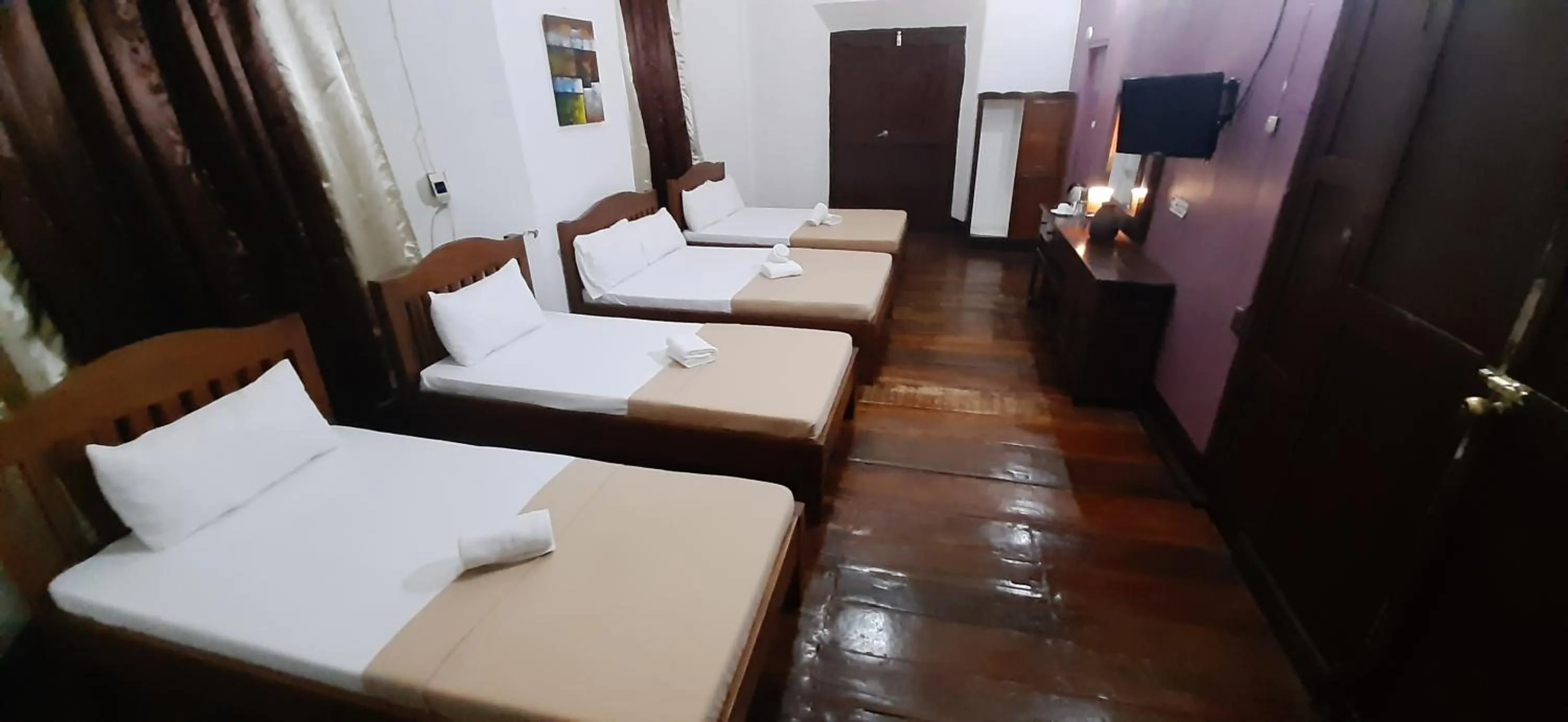 Bed in Escolta's Homey Lodge