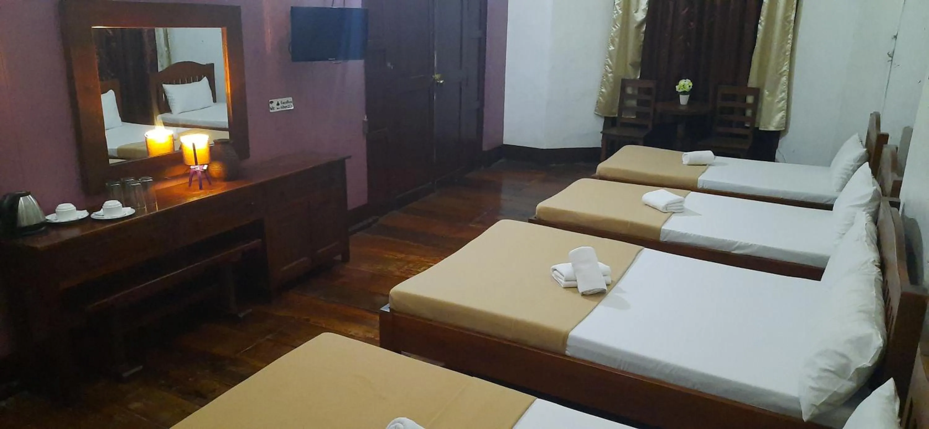 Bed in Escolta's Homey Lodge