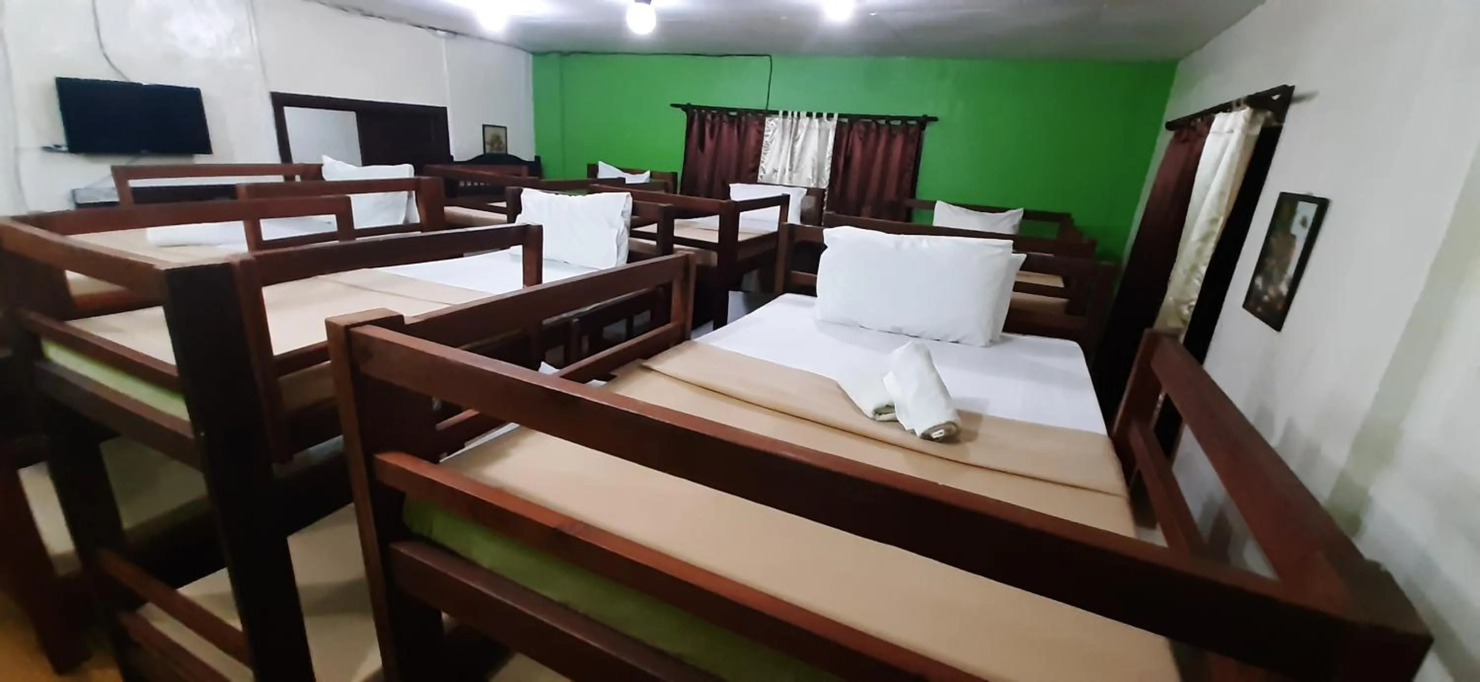 Bed in Escolta's Homey Lodge