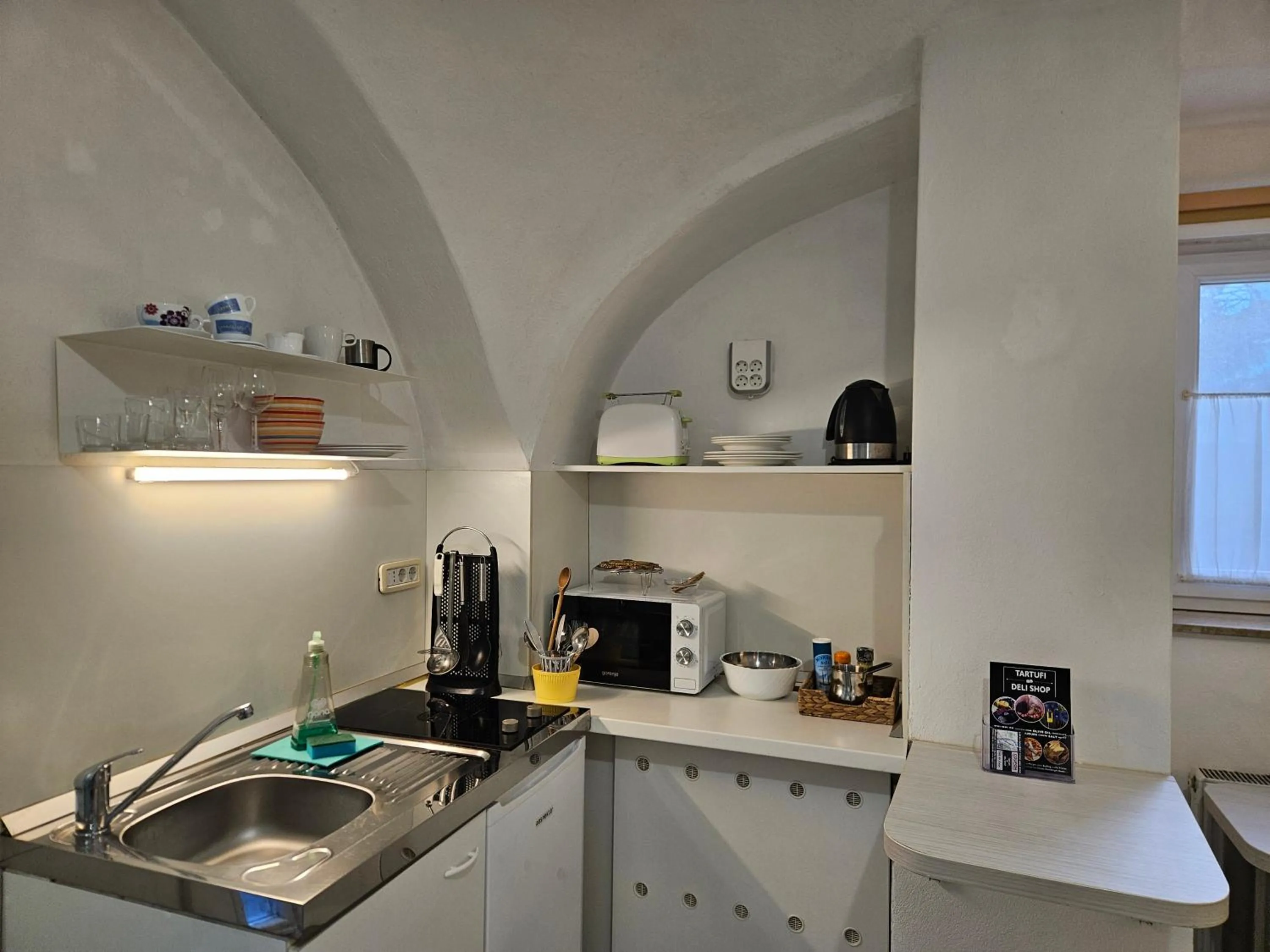 Kitchen or kitchenette in Tiny central studio apartment Nika Ljubljana