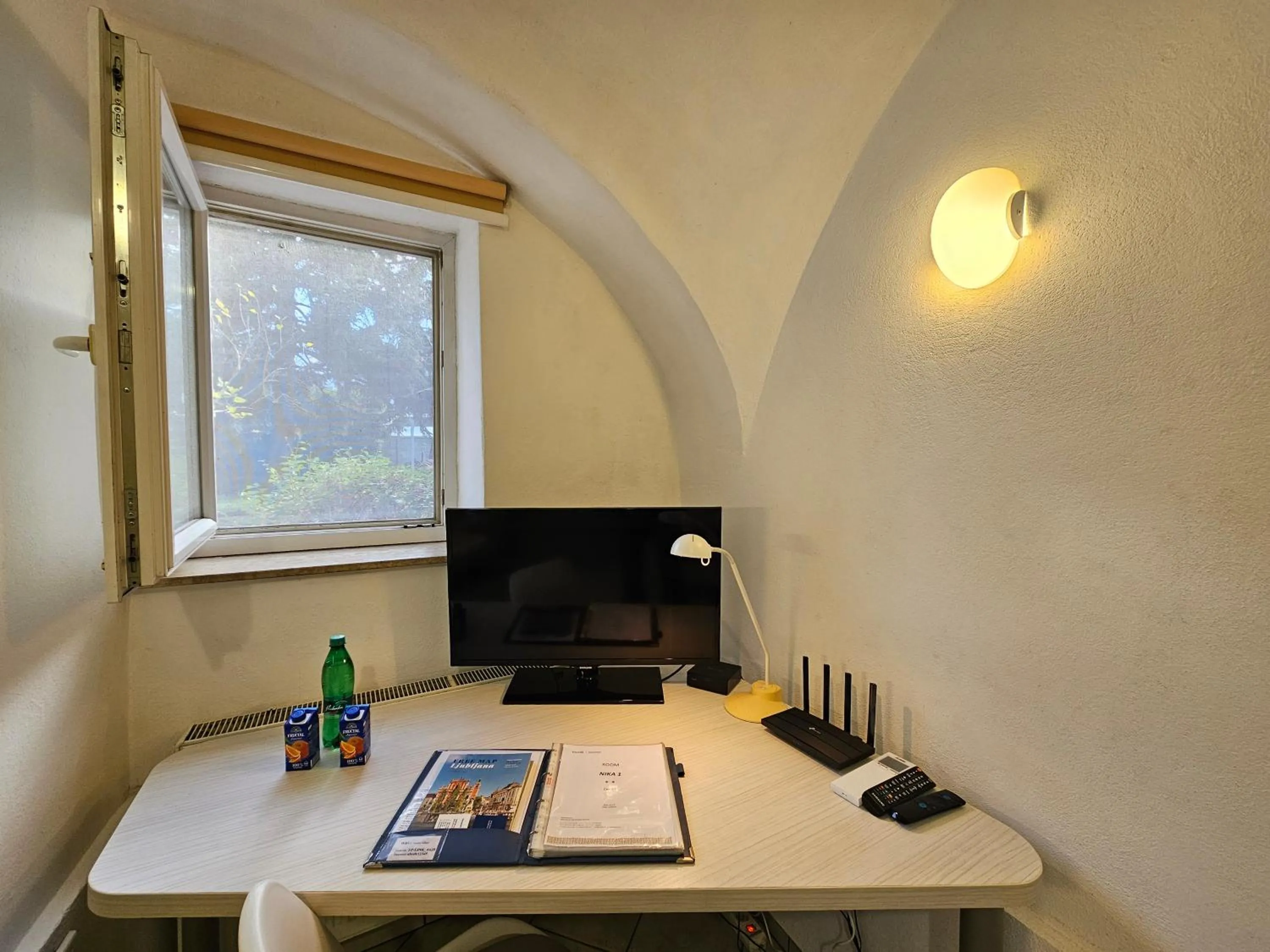 TV and multimedia in Tiny central studio apartment Nika Ljubljana