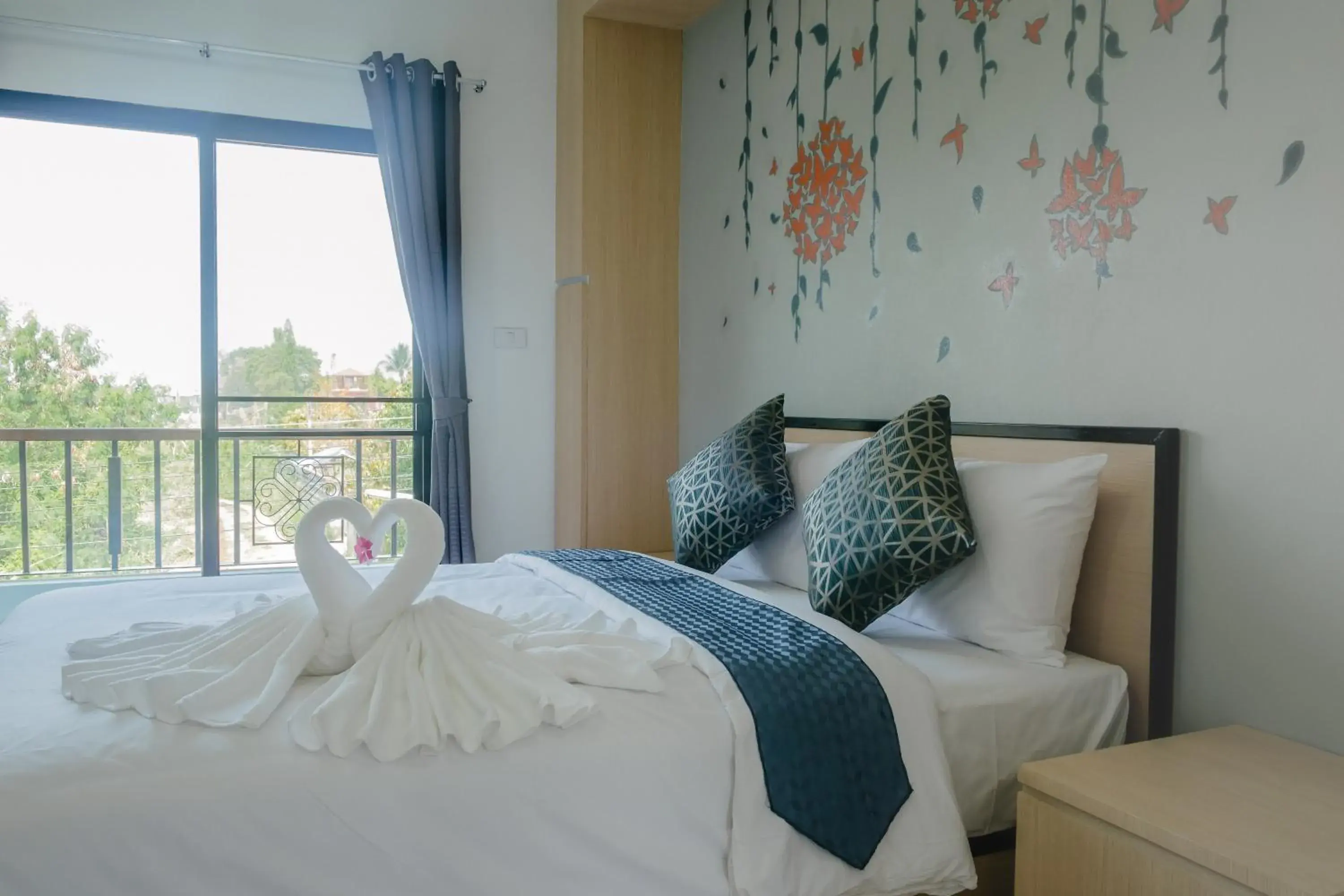 Balcony/Terrace, Bed in Sirimunta Hotel Chiang Rai Suite & Residence Balcony/Terrace, Bed in Sirimunta Hotel Chiang Rai Suite & Residence