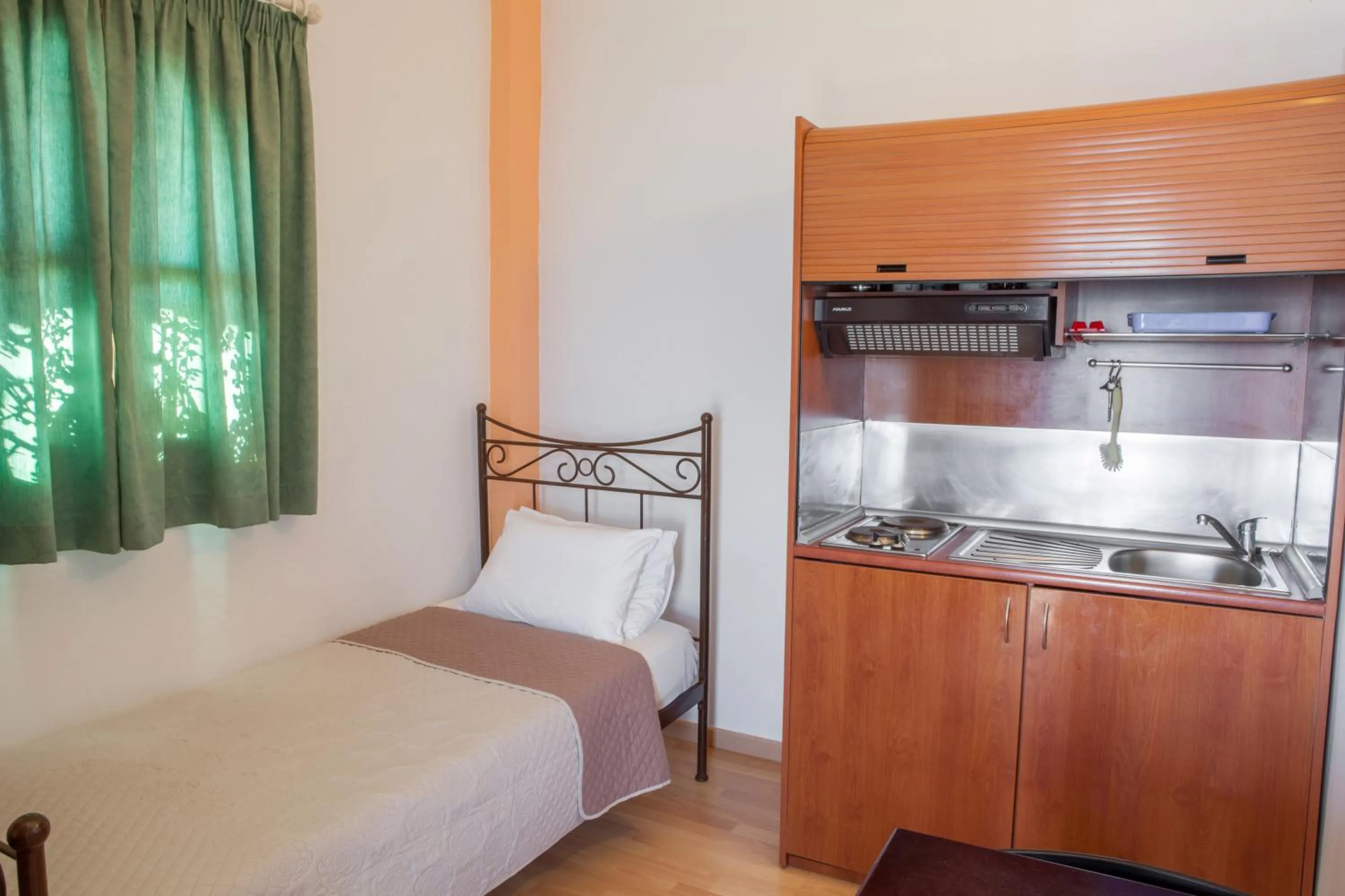 Kitchen or kitchenette, Bed in Mari Hotel & Maisonettes