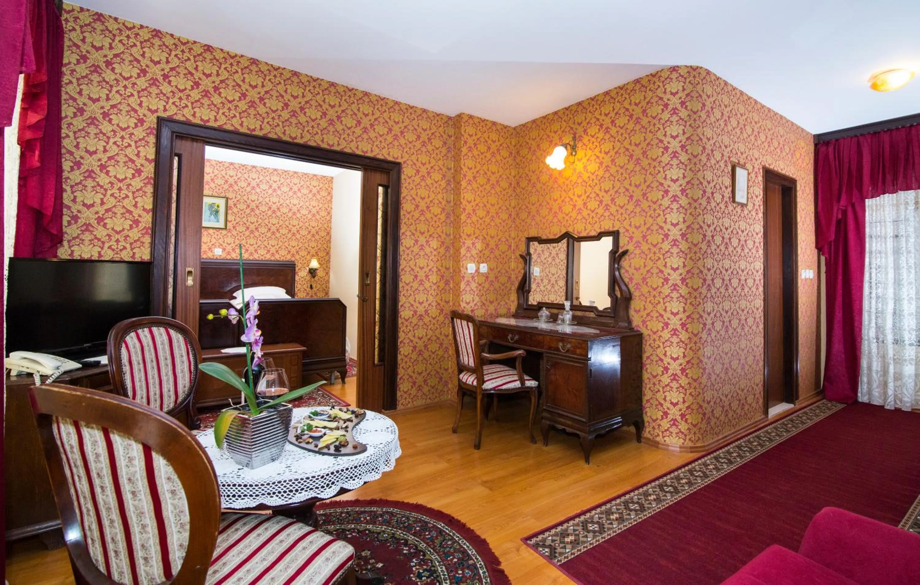 Communal lounge/ TV room, Bed in Heritage Hotel Pasike