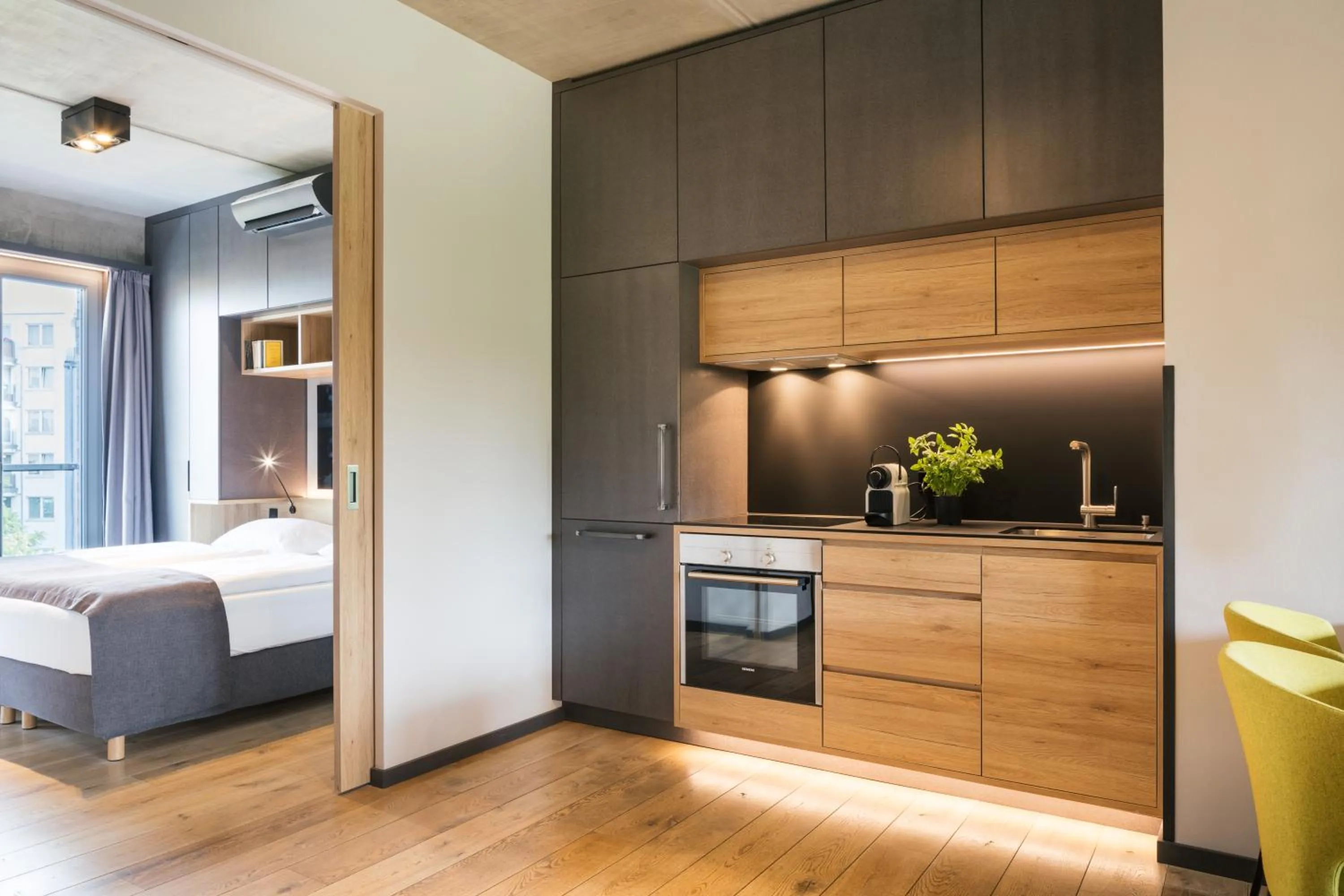 Kitchen or kitchenette, Bed in Downtown Apartments Mitte