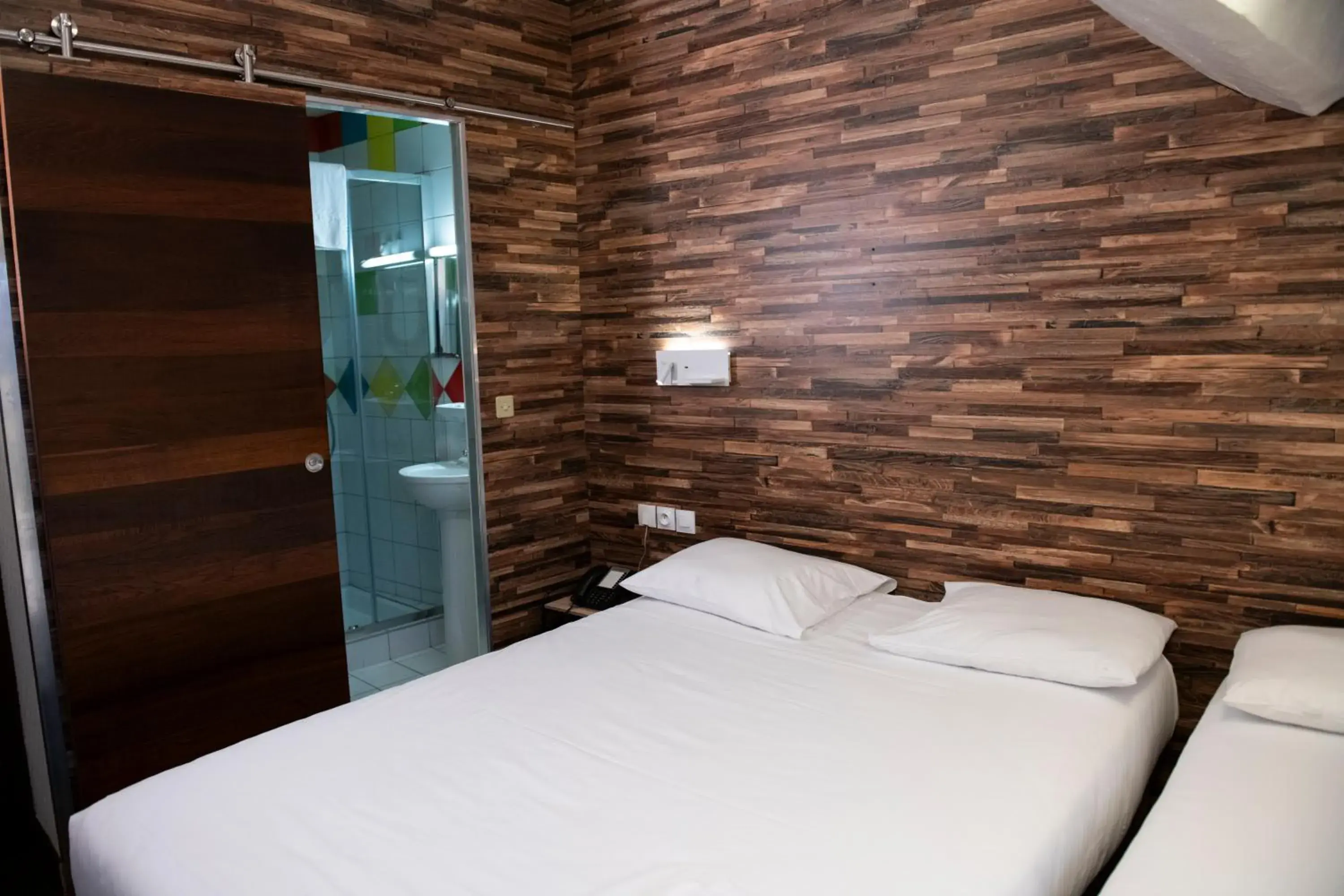 Bed in Hôtel du Helder Bed in Hôtel du Helder