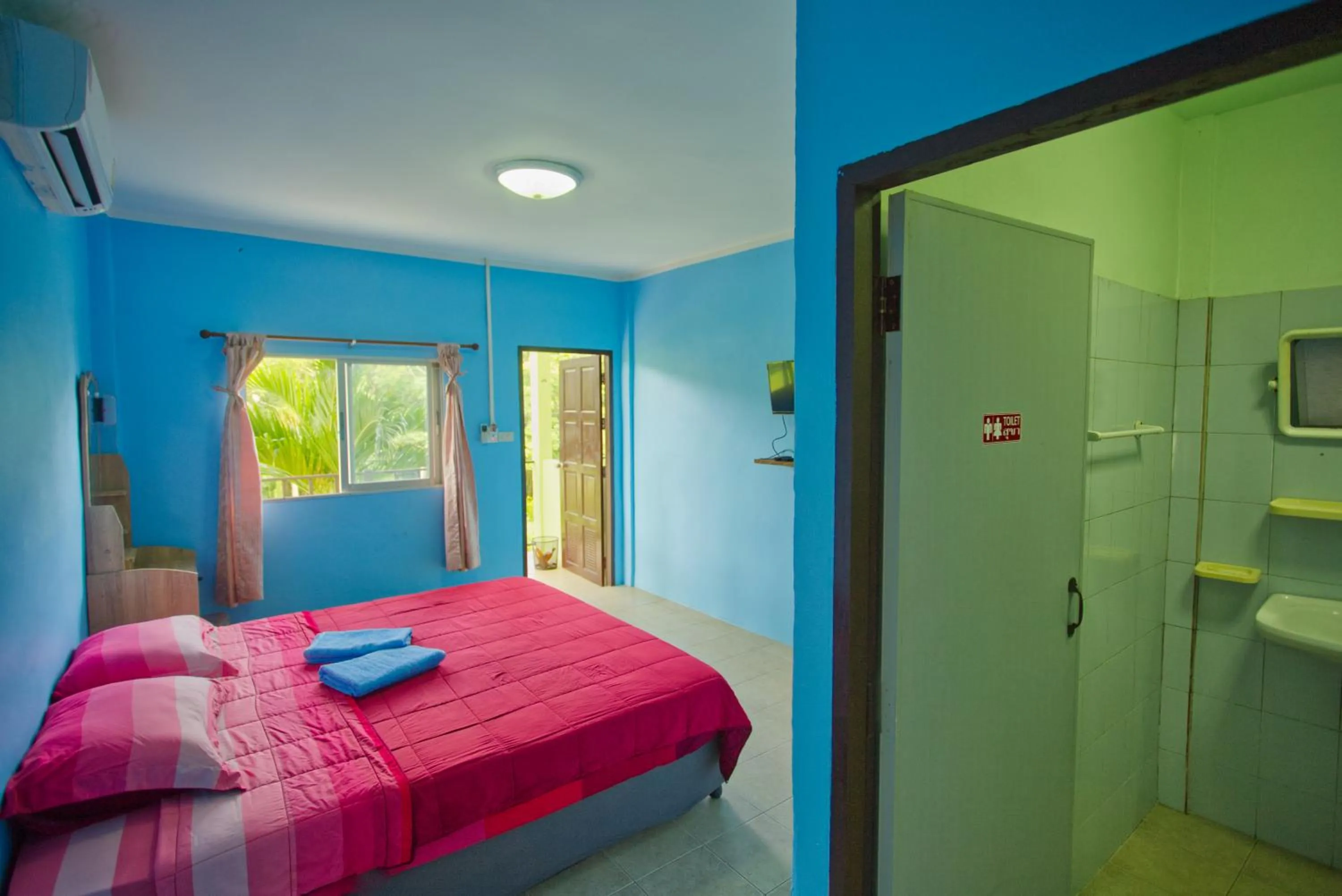 Toilet, Bed in Sea View Resort