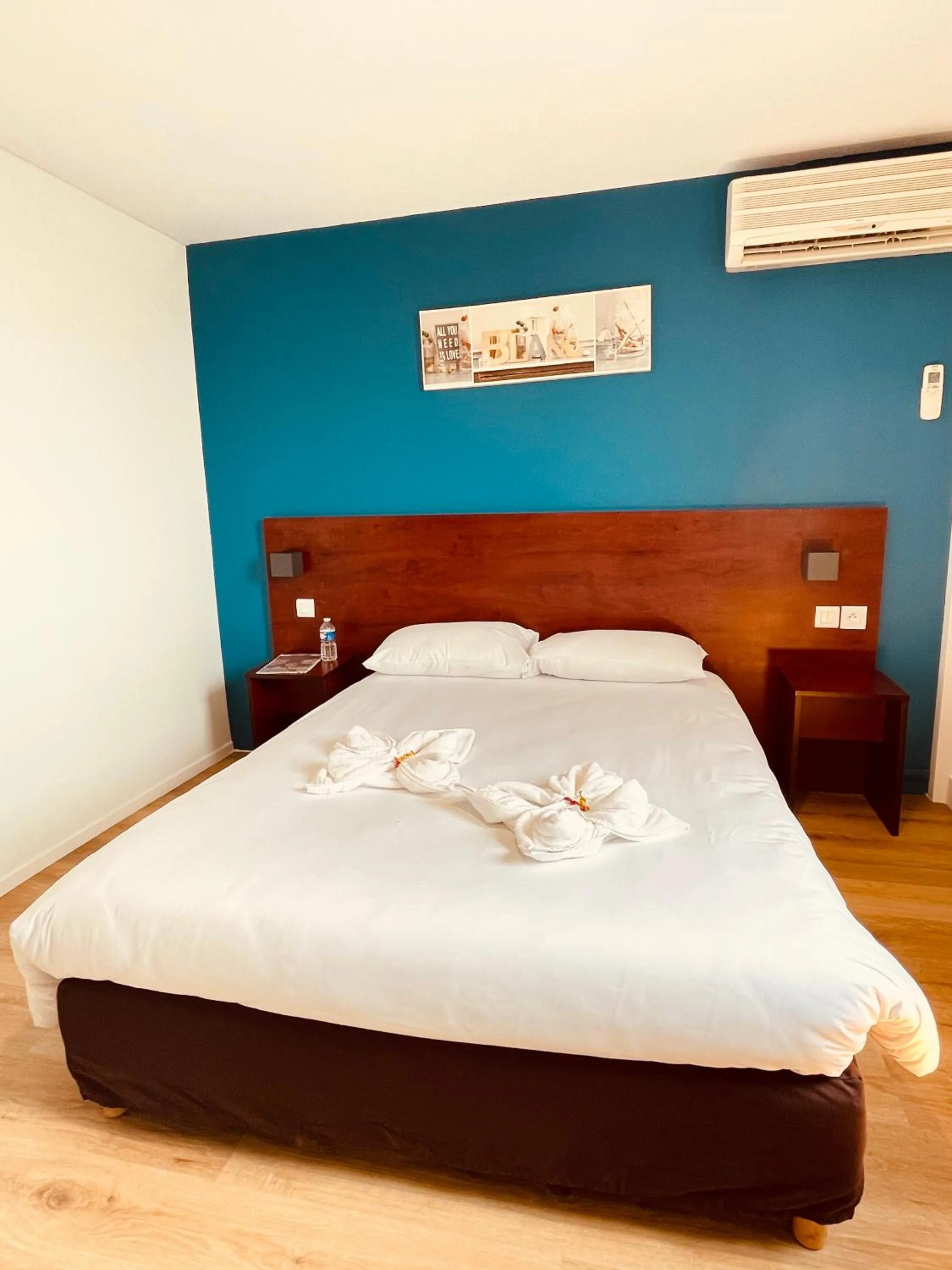 Bed in Initial by Balladins Lyon Villefranche-sur-Saône