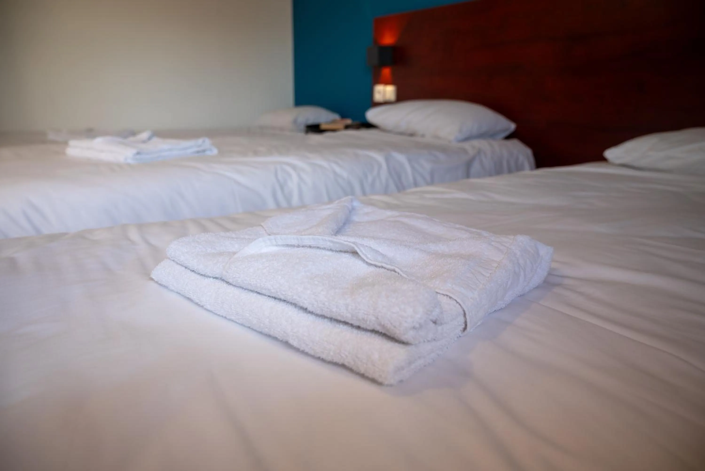 Bed in Initial by Balladins Lyon Villefranche-sur-Saône