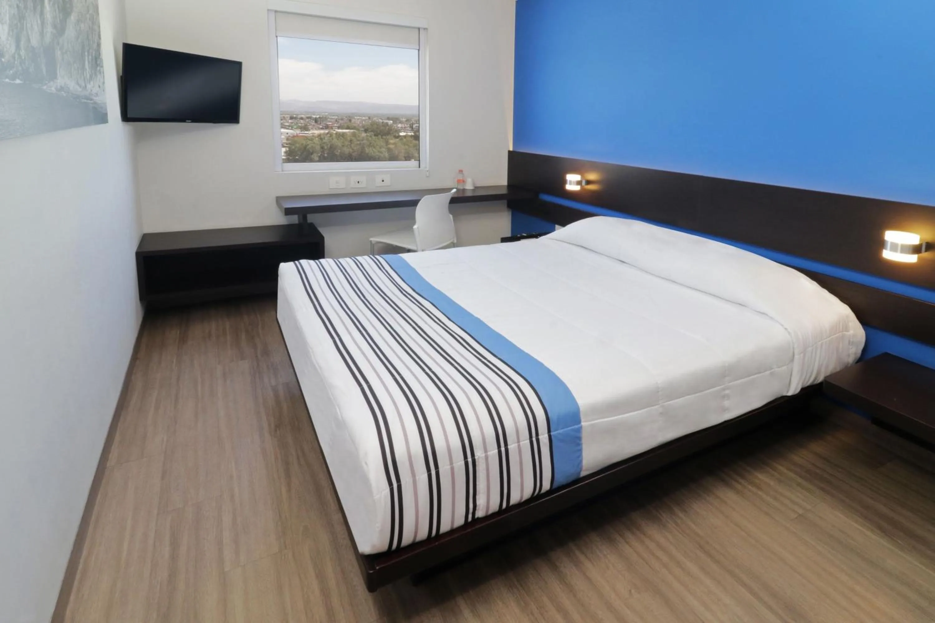 Bedroom, Bed in City Express Junior by Marriott Merida Altabrisa