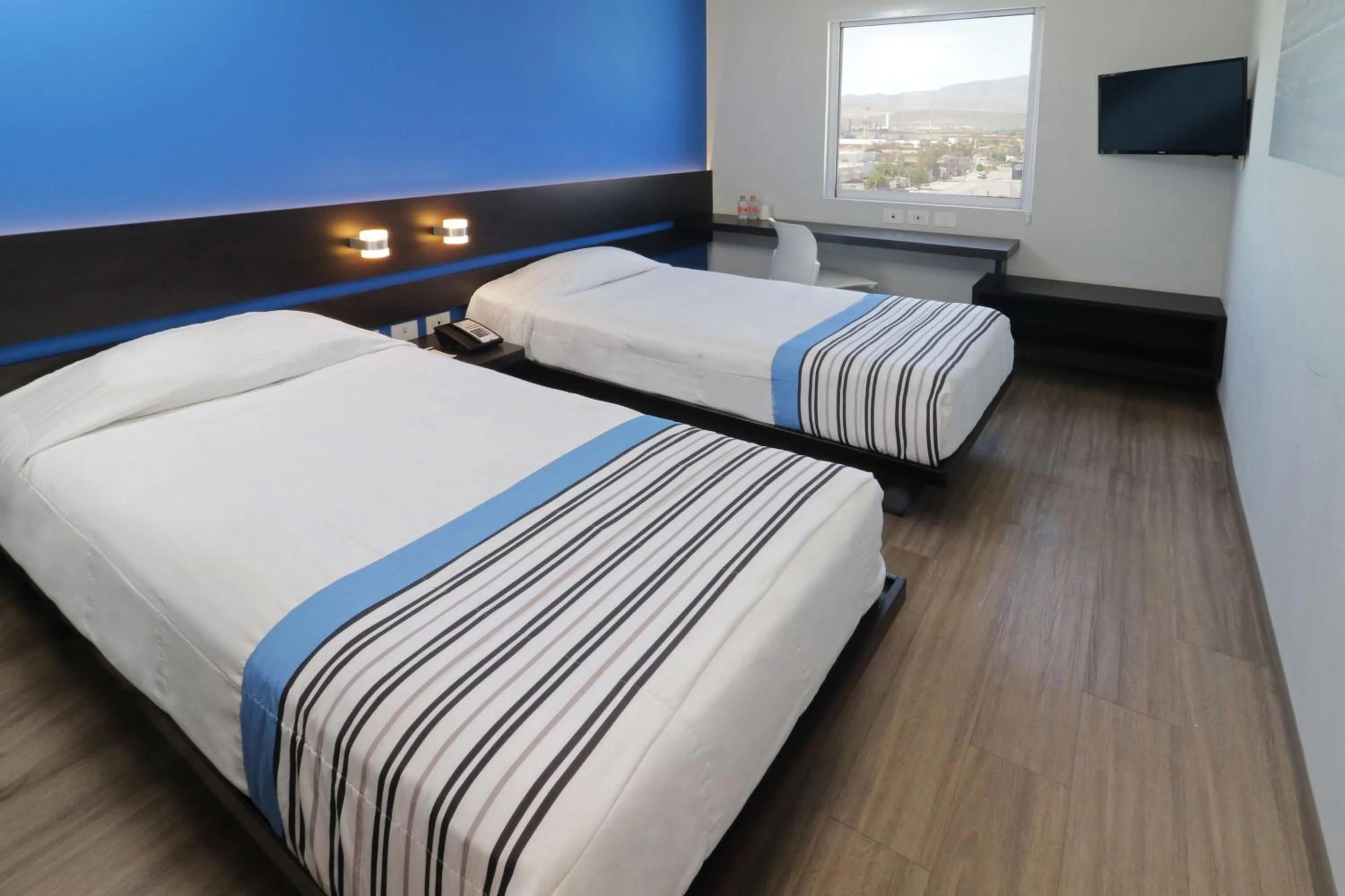 Bedroom, Bed in City Express Junior by Marriott Merida Altabrisa