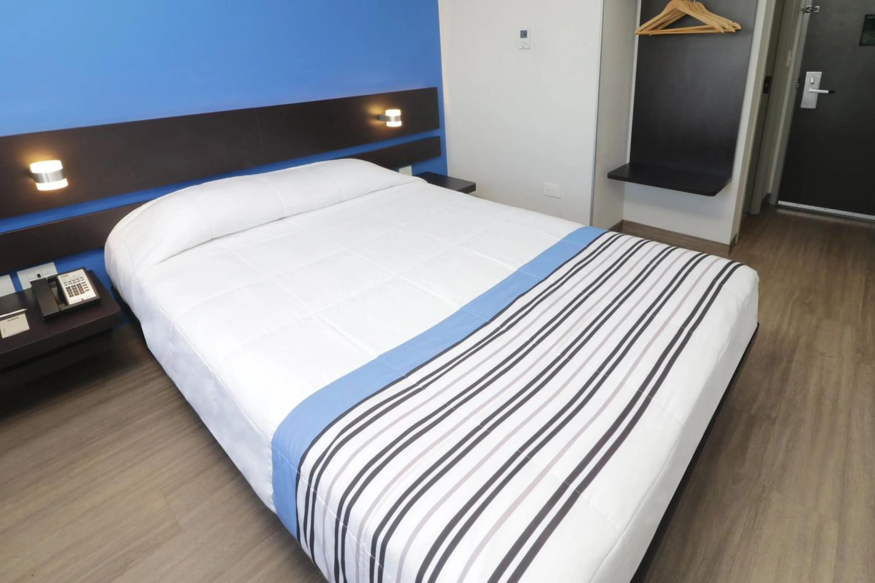 Bedroom, Bed in City Express Junior by Marriott Merida Altabrisa