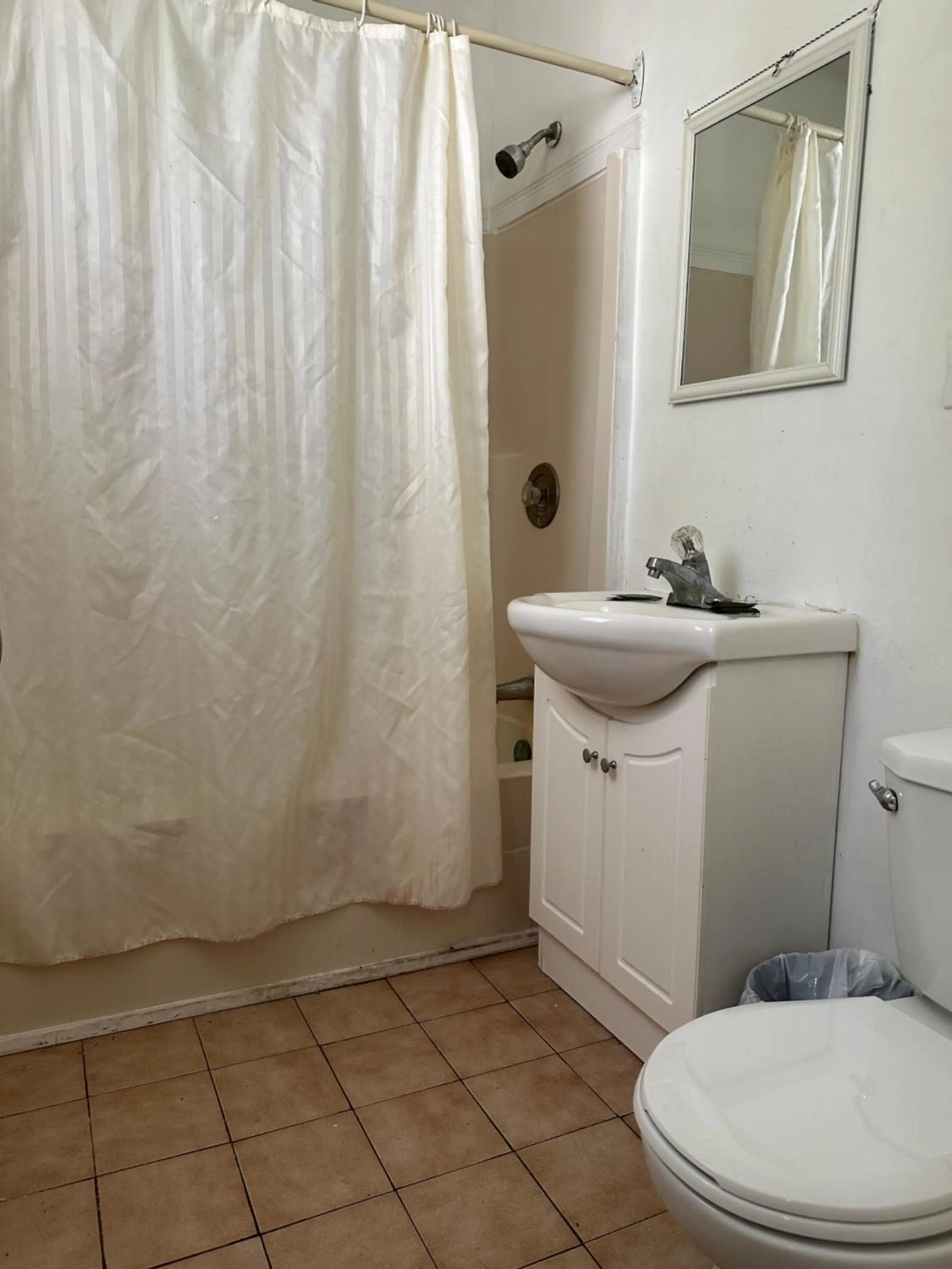 Toilet in Carriage Inn Motel