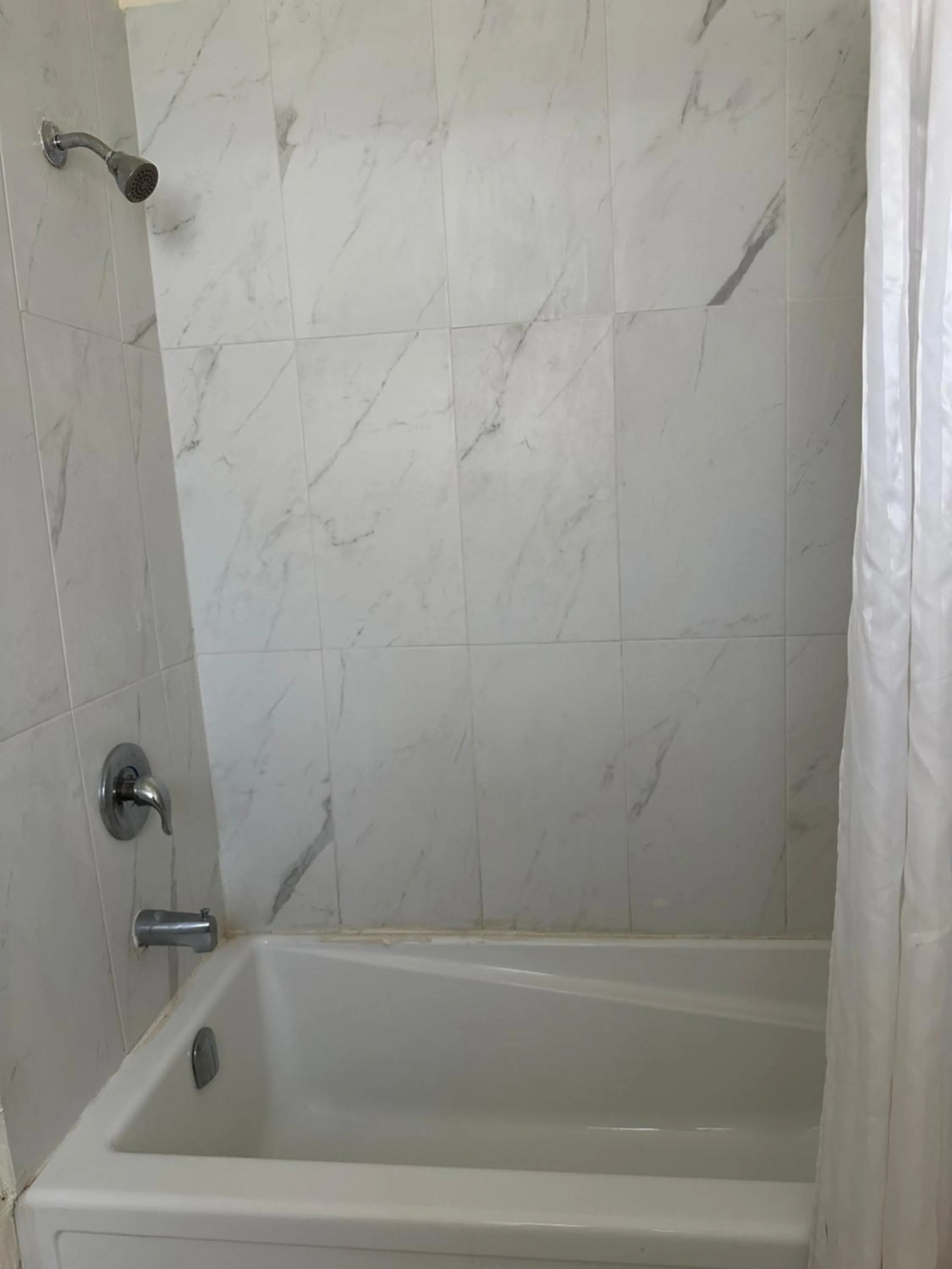 Shower in Carriage Inn Motel