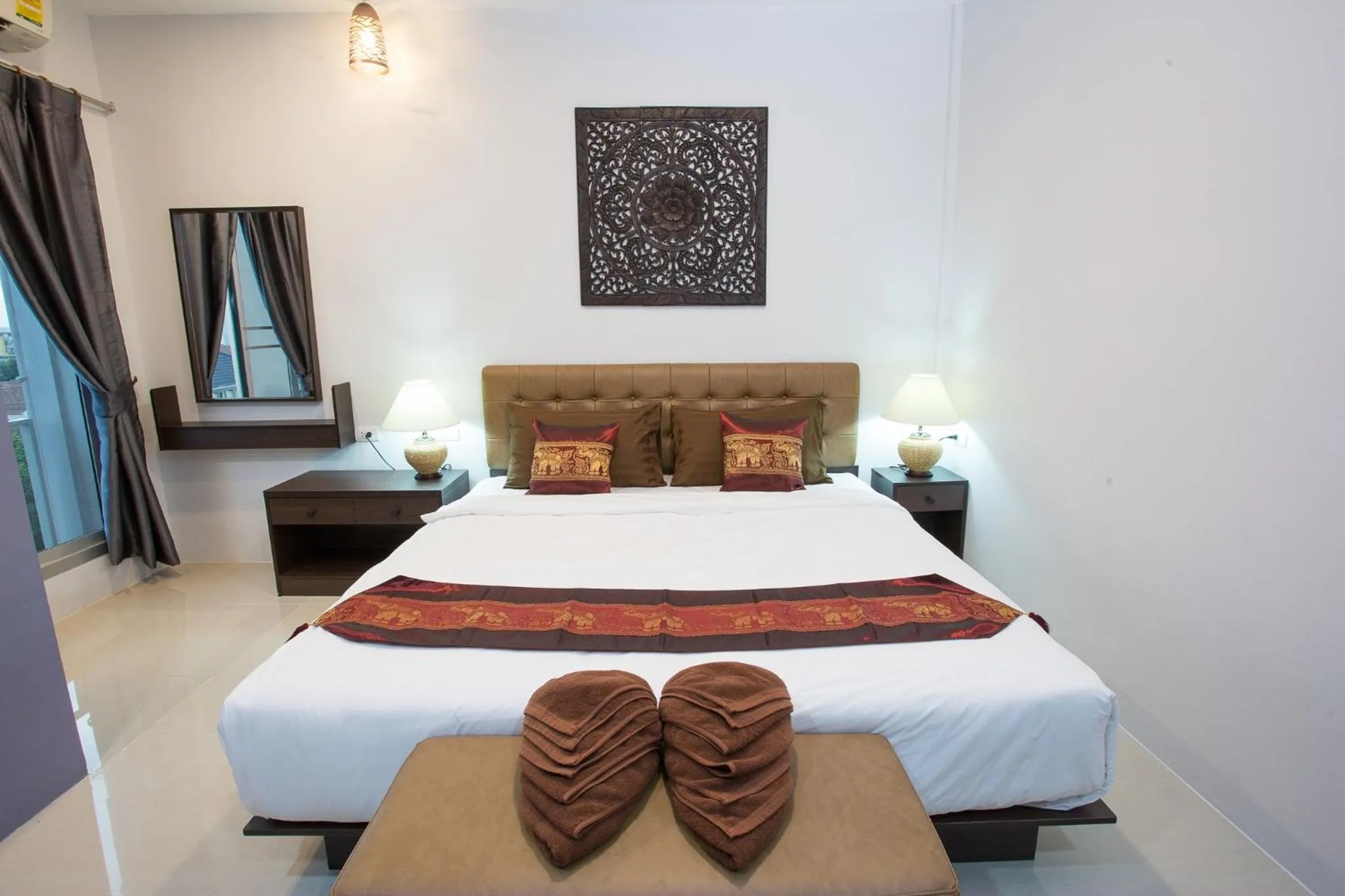 Bed in Pongsakorn Boutique Resort