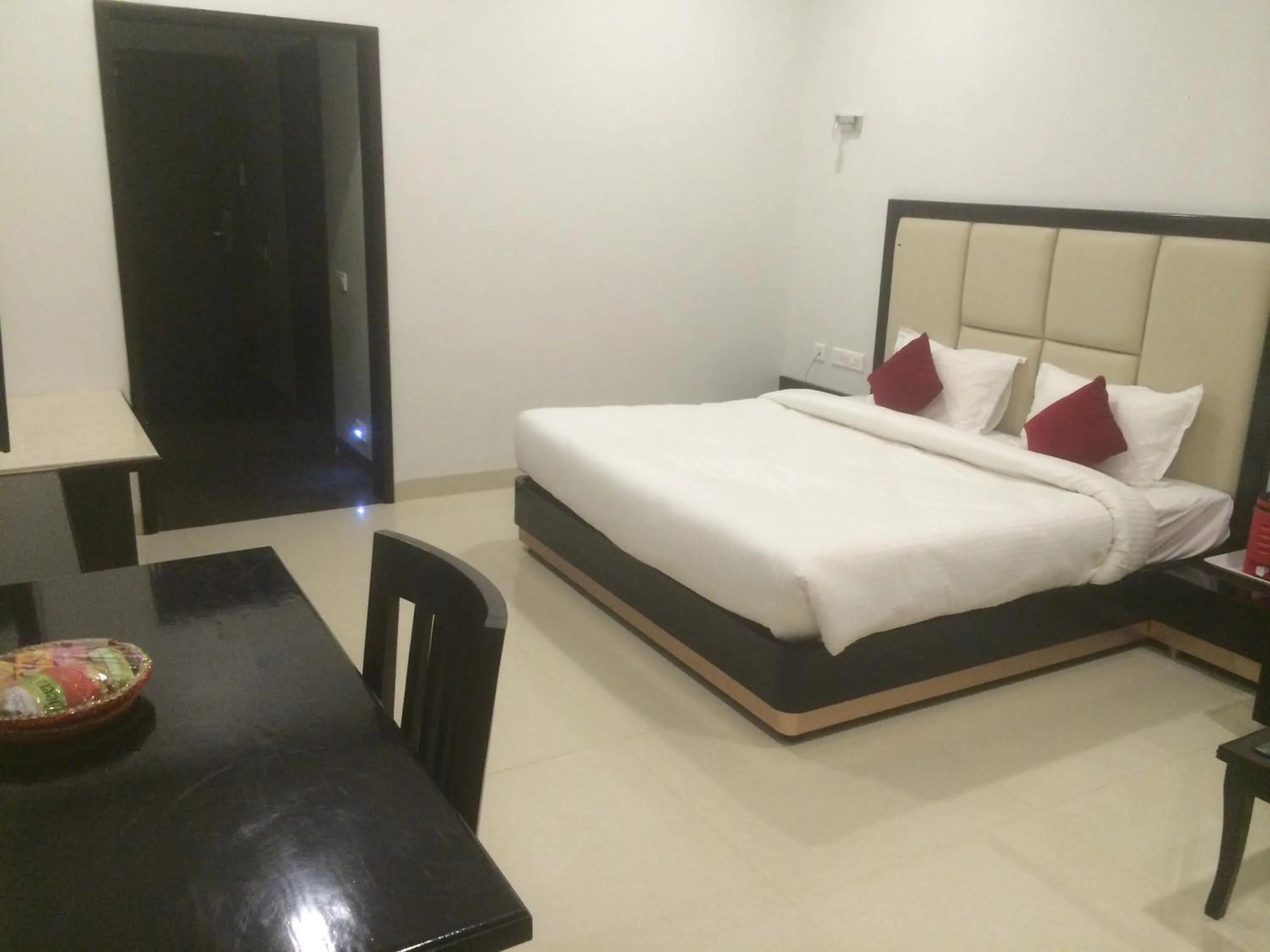 Photo of the whole room, Bed in Chandra Grand