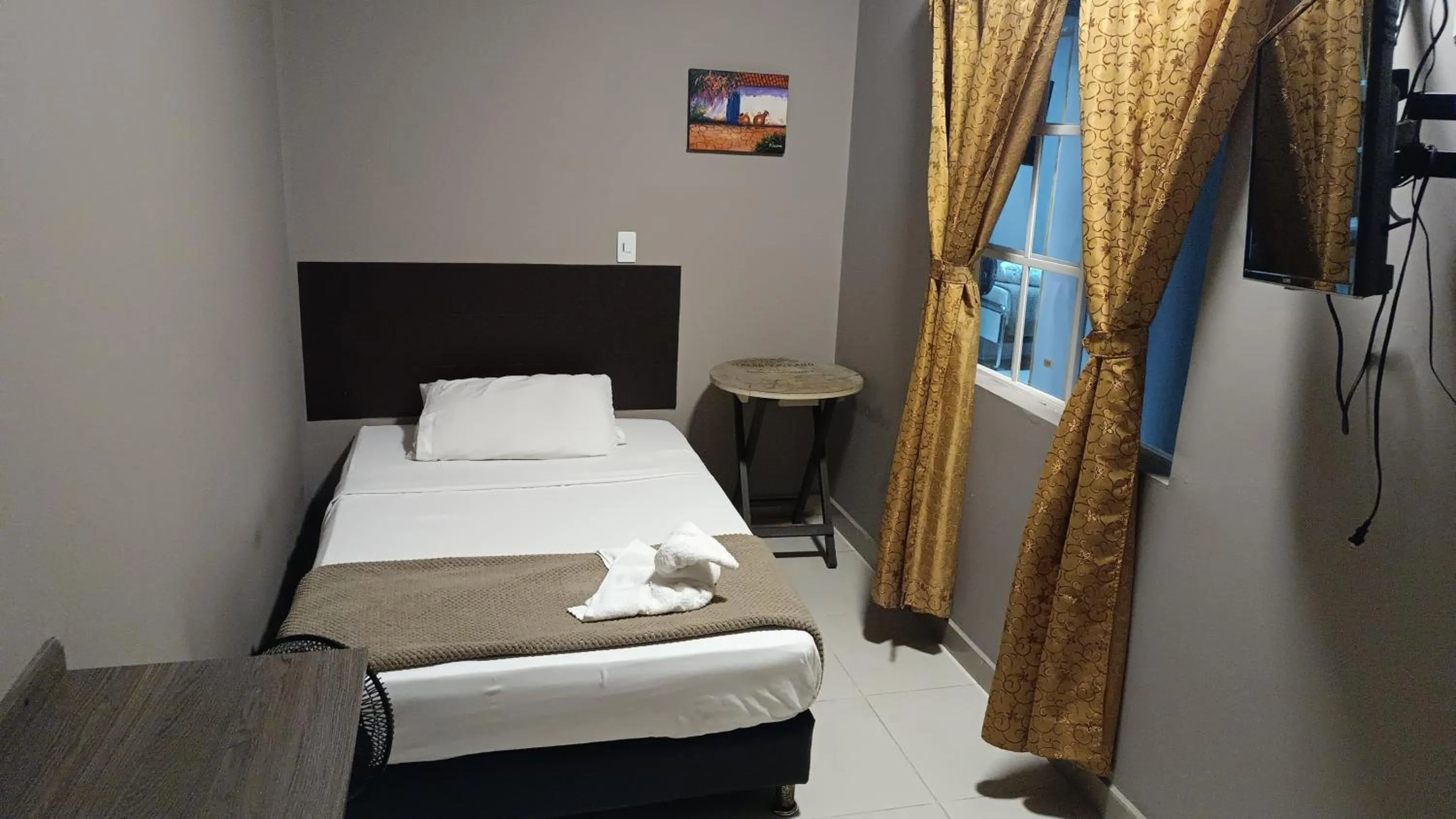 Bed in Hotel Simón Plaza