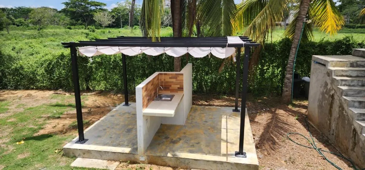 BBQ facilities in Cabaña Los Cristales Coveñas by Amauna