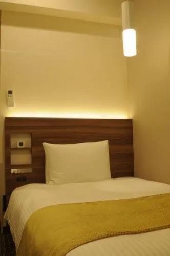 Bed in Hotel Sunroute Kumagaya Station