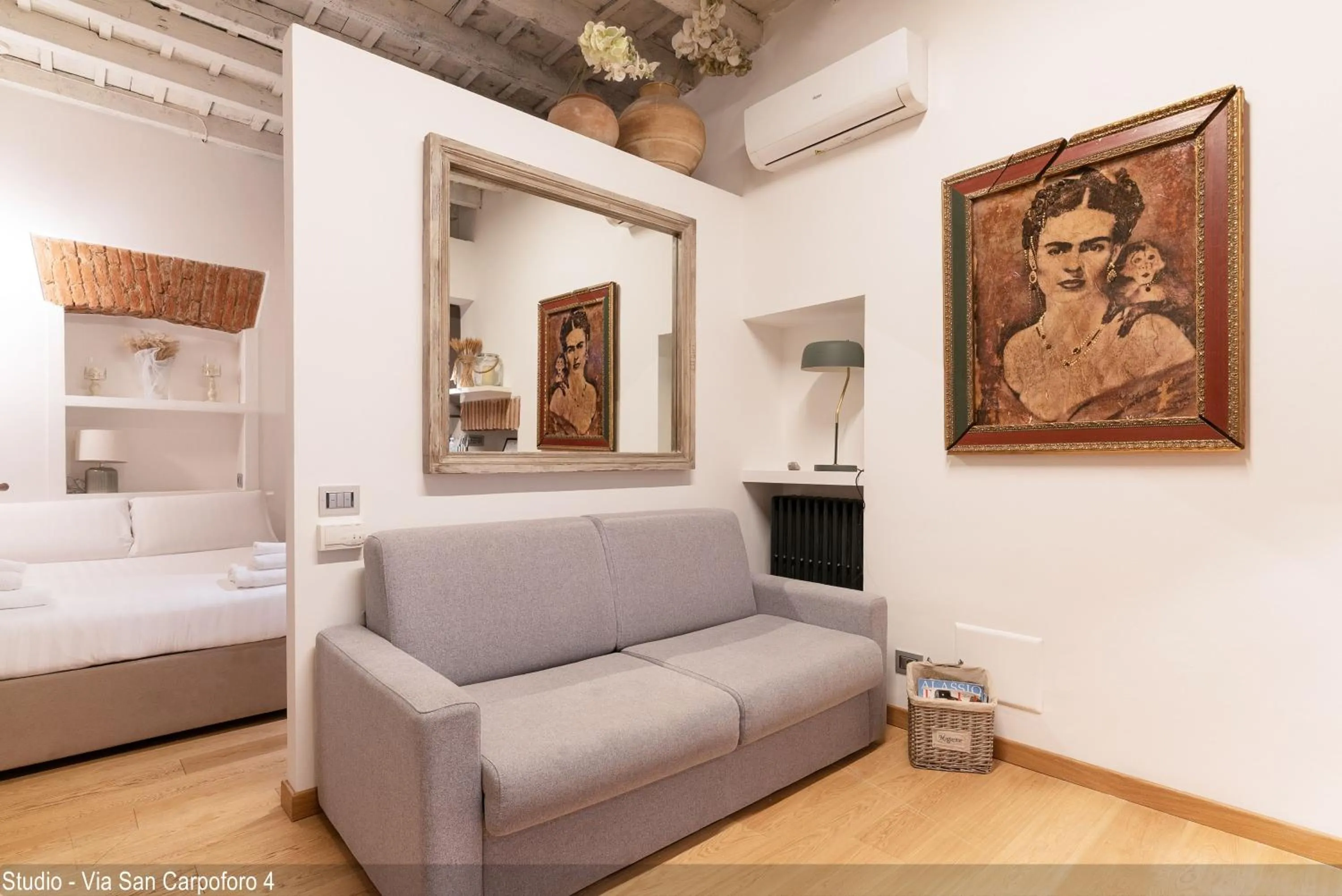 Seating area, Bed in Brera Apartments