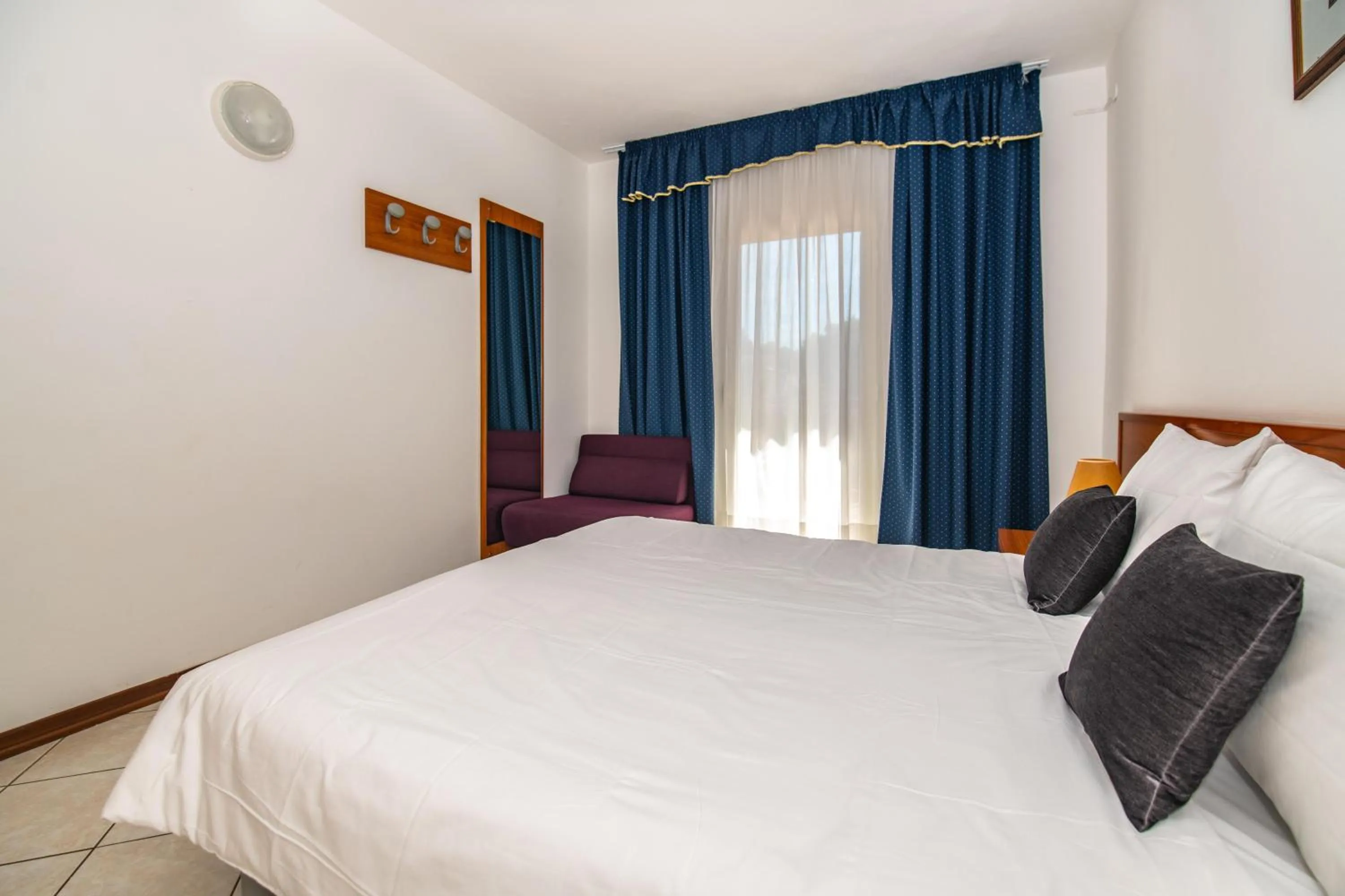 Photo of the whole room, Bed in Ai Pini Medulin Resort