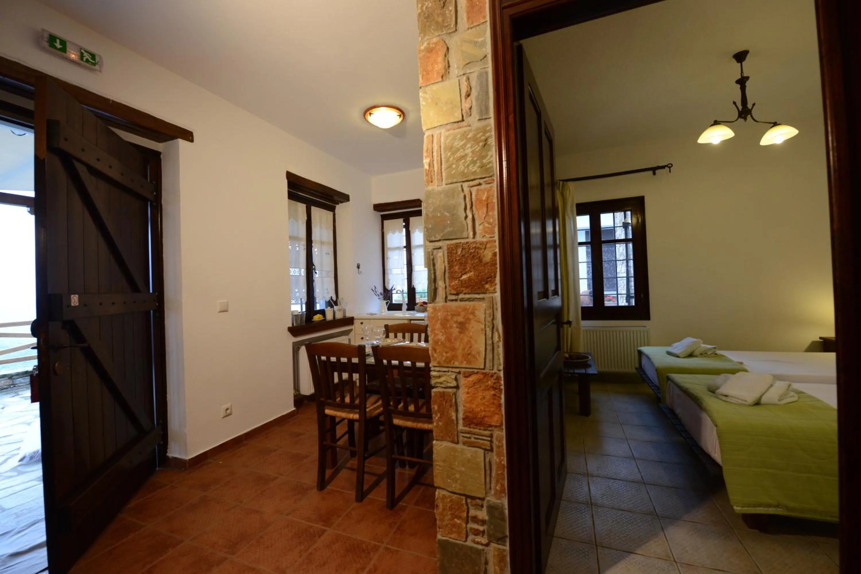 Kitchen or kitchenette, Bed in Esperos Suites & Villas