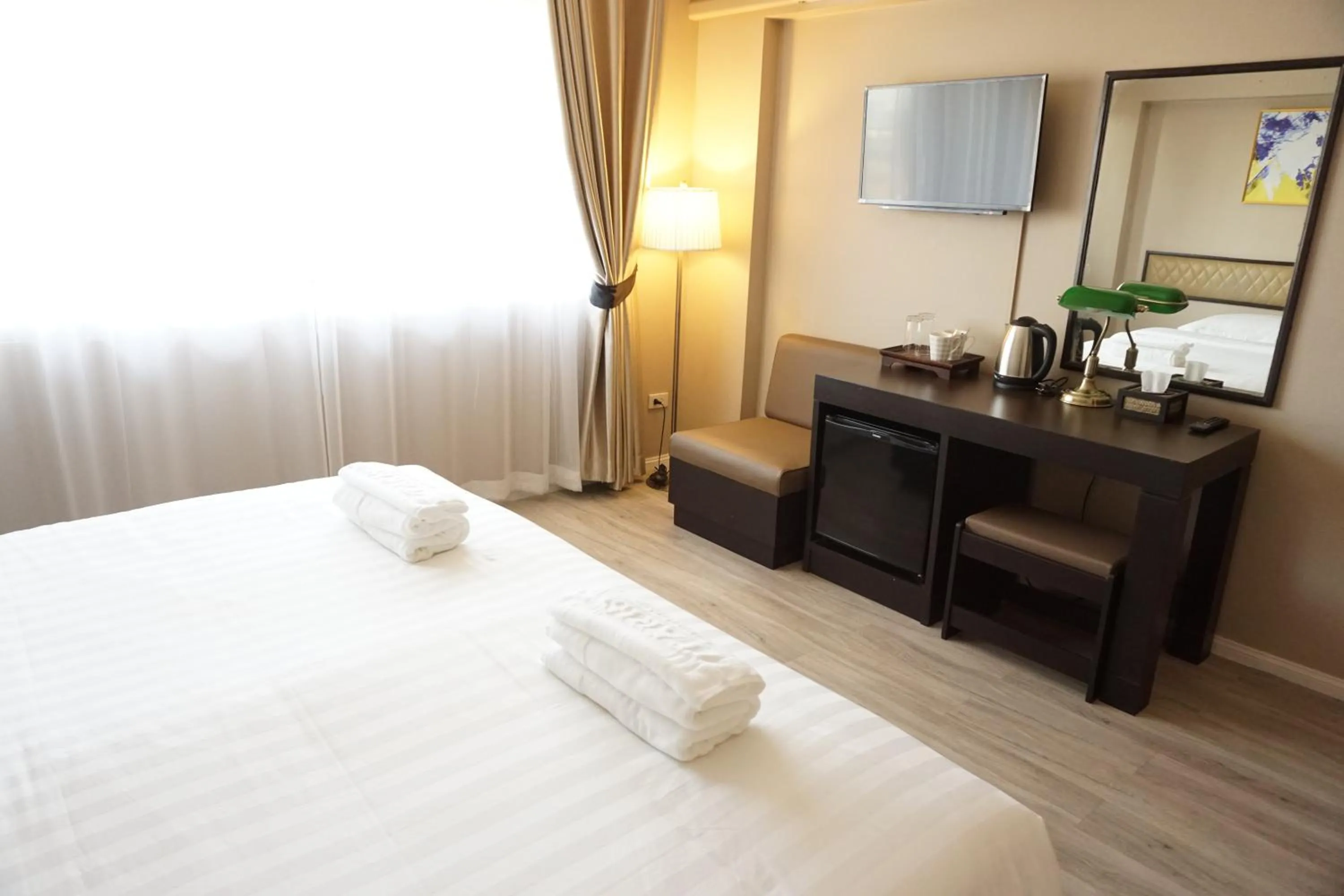 Bed in Taris Art Hotel Phrae