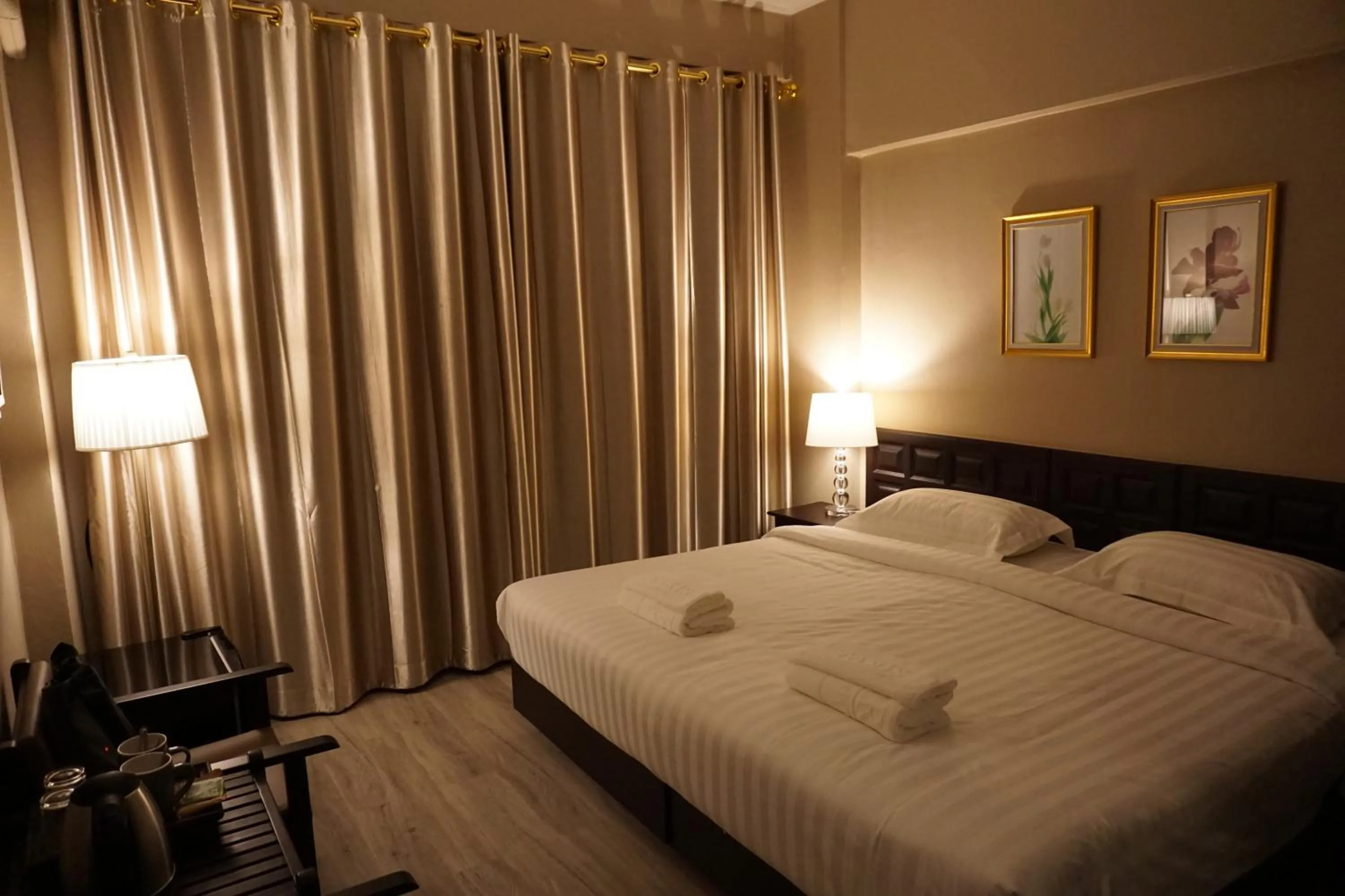 Bed in Taris Art Hotel Phrae