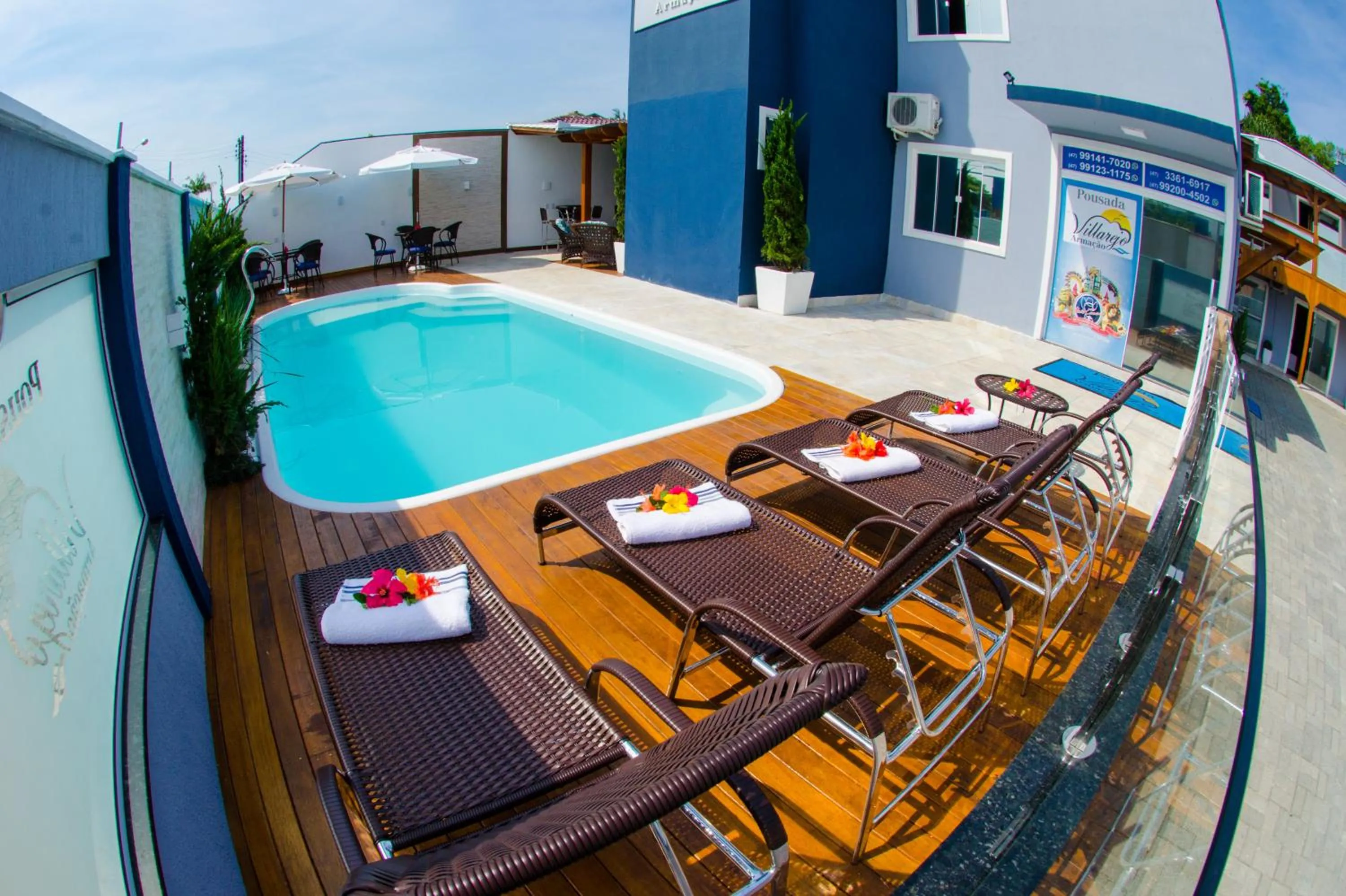 Swimming pool in Pousada Villarejo Armação