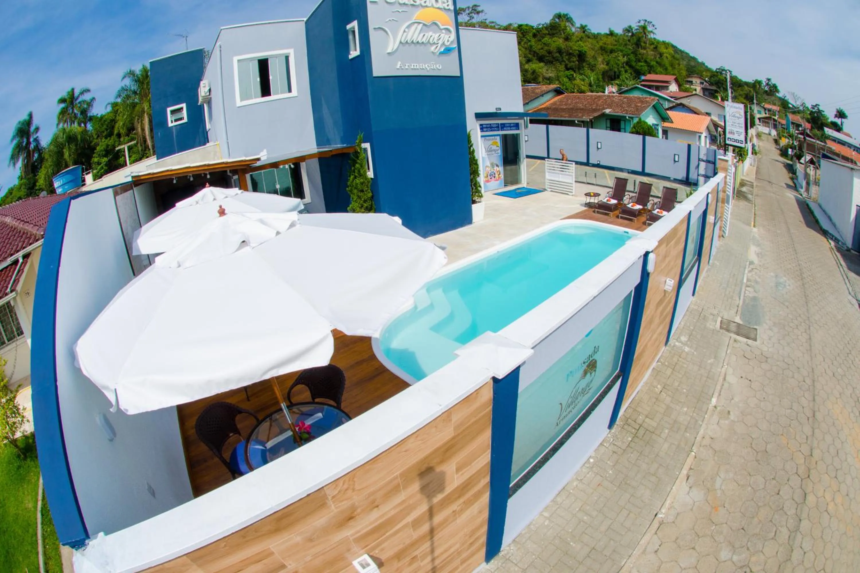Swimming pool in Pousada Villarejo Armação