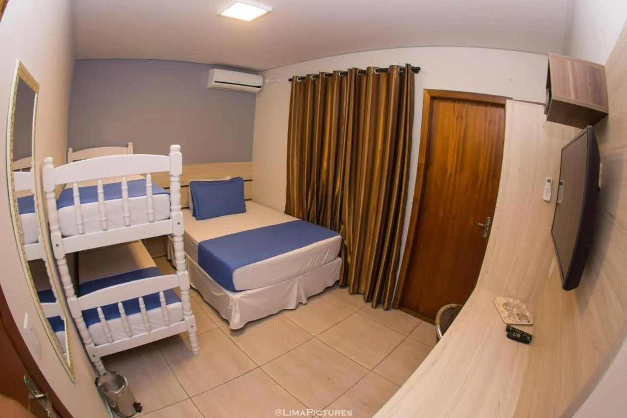 Bed in Pousada Villarejo Armação