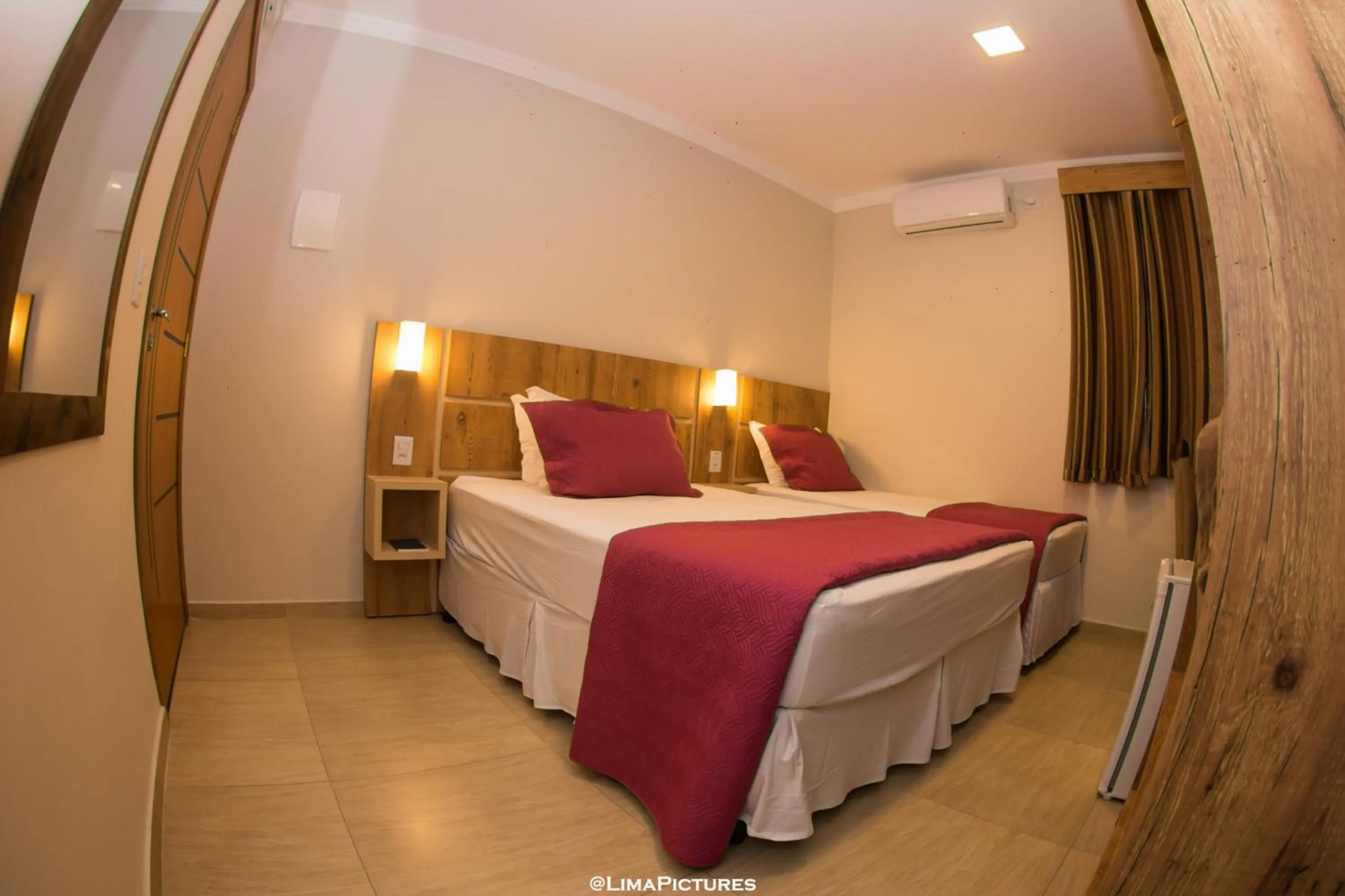 Bed in Pousada Villarejo Armação