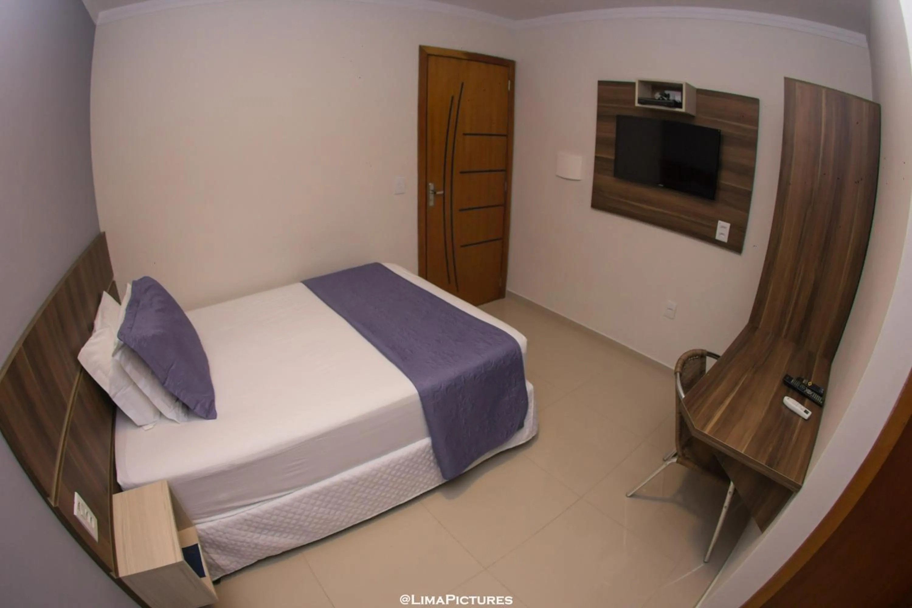 Bed in Pousada Villarejo Armação