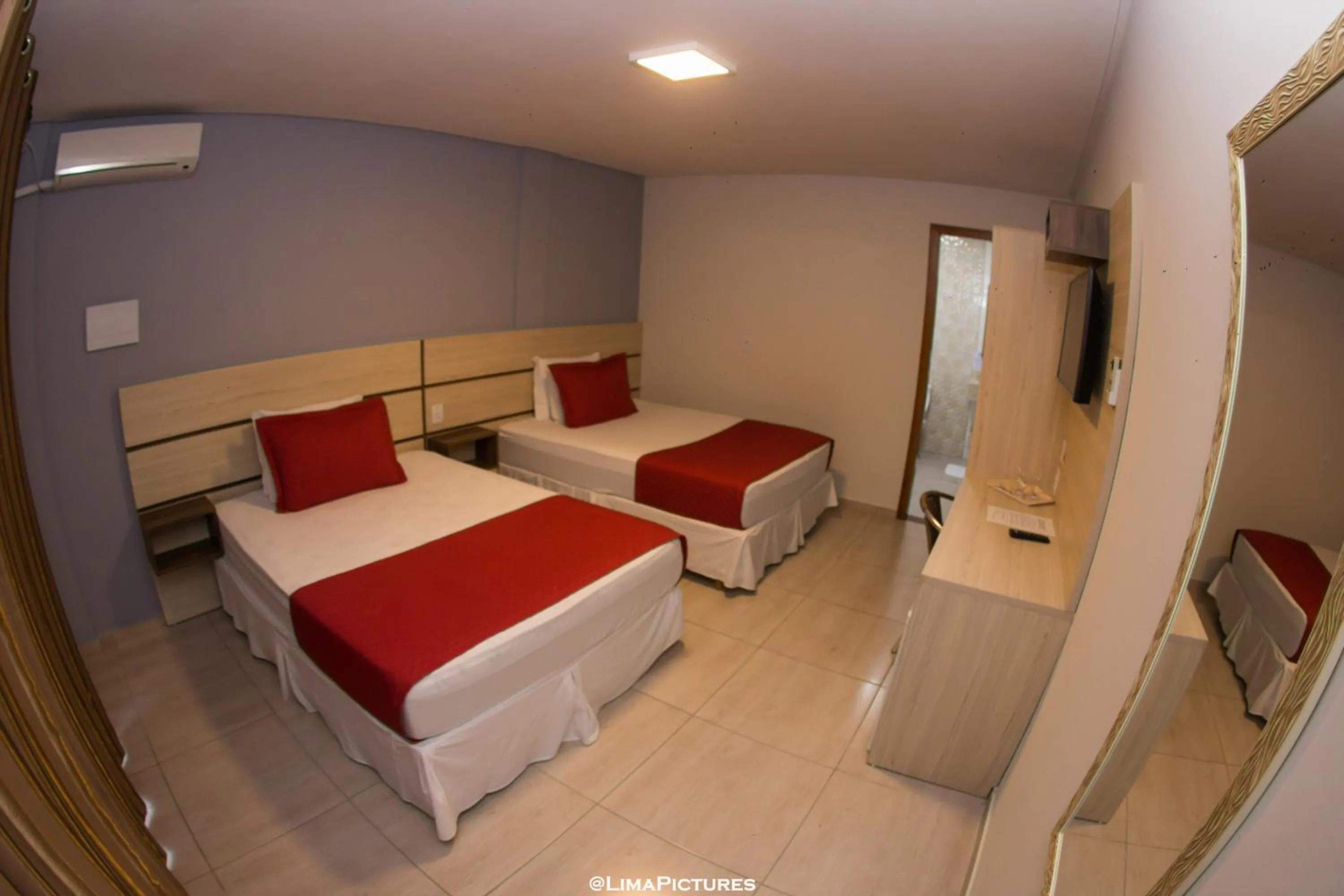 Bed in Pousada Villarejo Armação